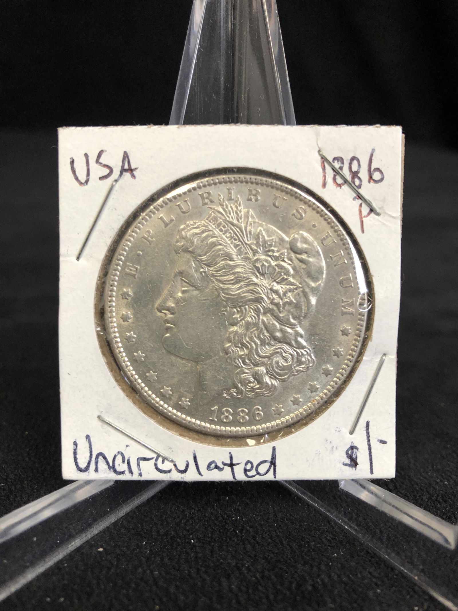 1886 USA MORGAN SILVER DOLLAR (UNCIRCULATED) (1 of 2)