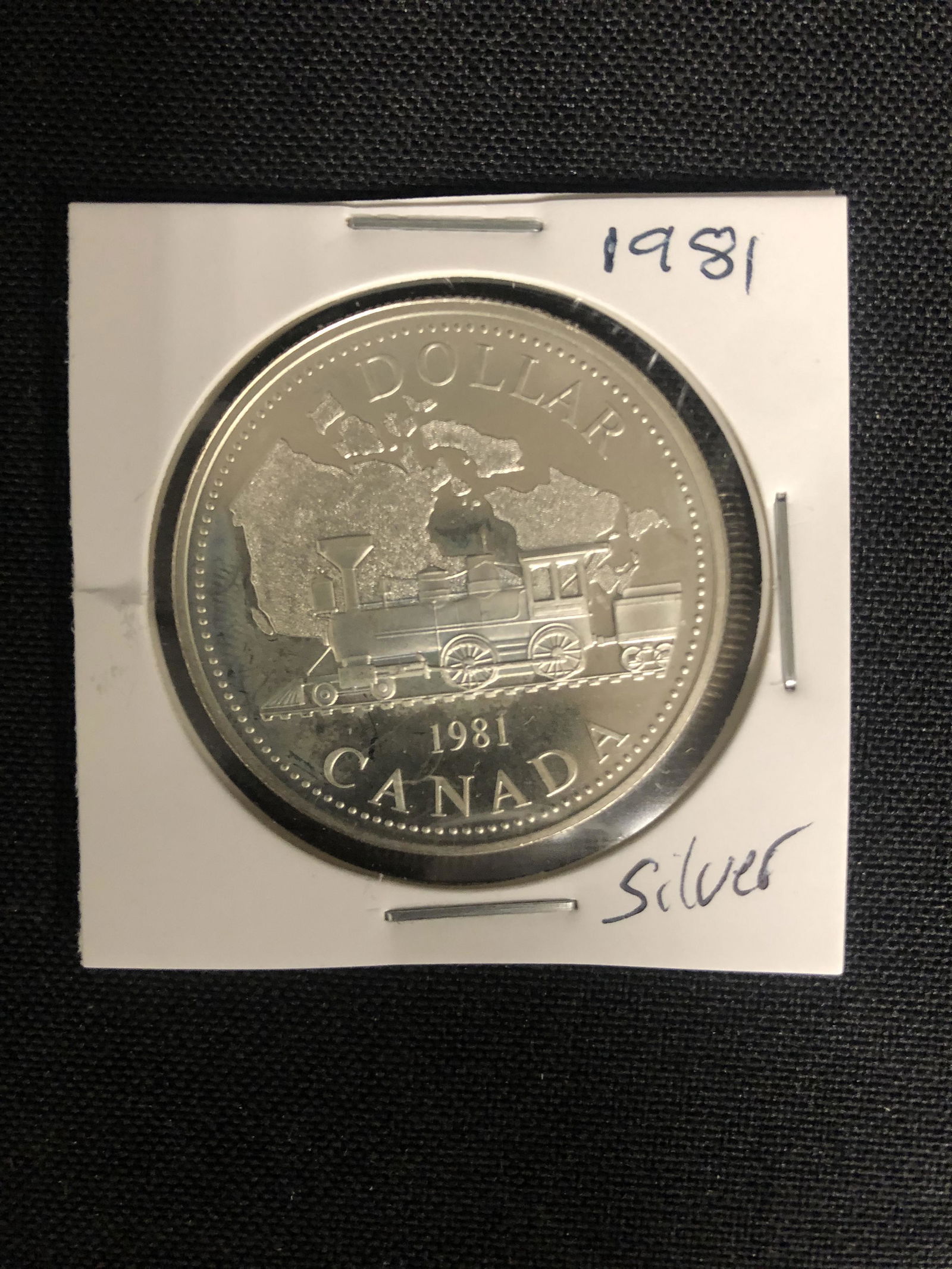 1981  CANADIAN SILVER DOLLAR {MADE OF SILVER NOT (1 of 1)