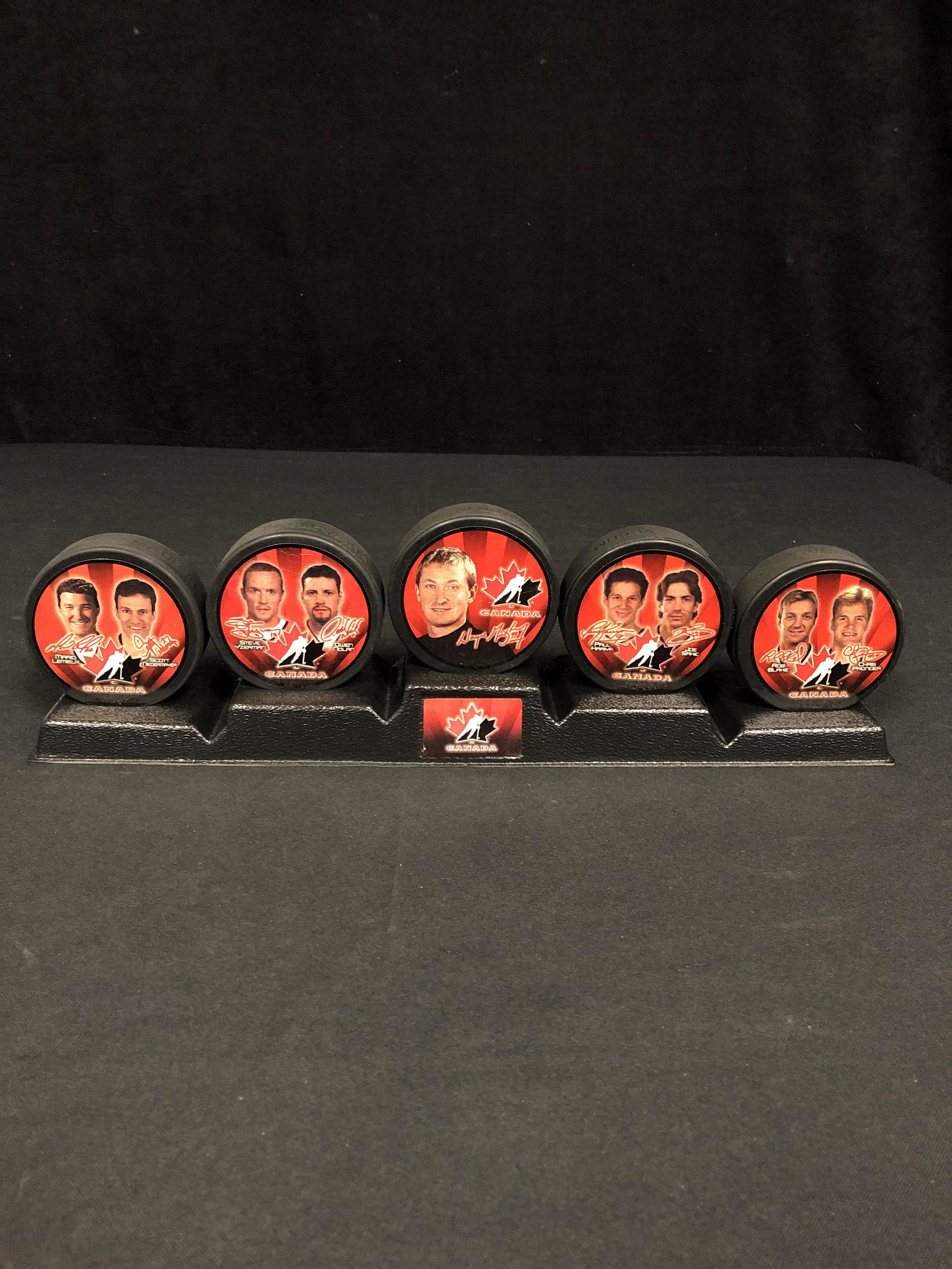 MCDONALDS OLYMPIC HOCKEY PUCK LOT WITH STAND: MCDONALDS OLYMPIC HOCKEY PUCK LOT WITH STAND