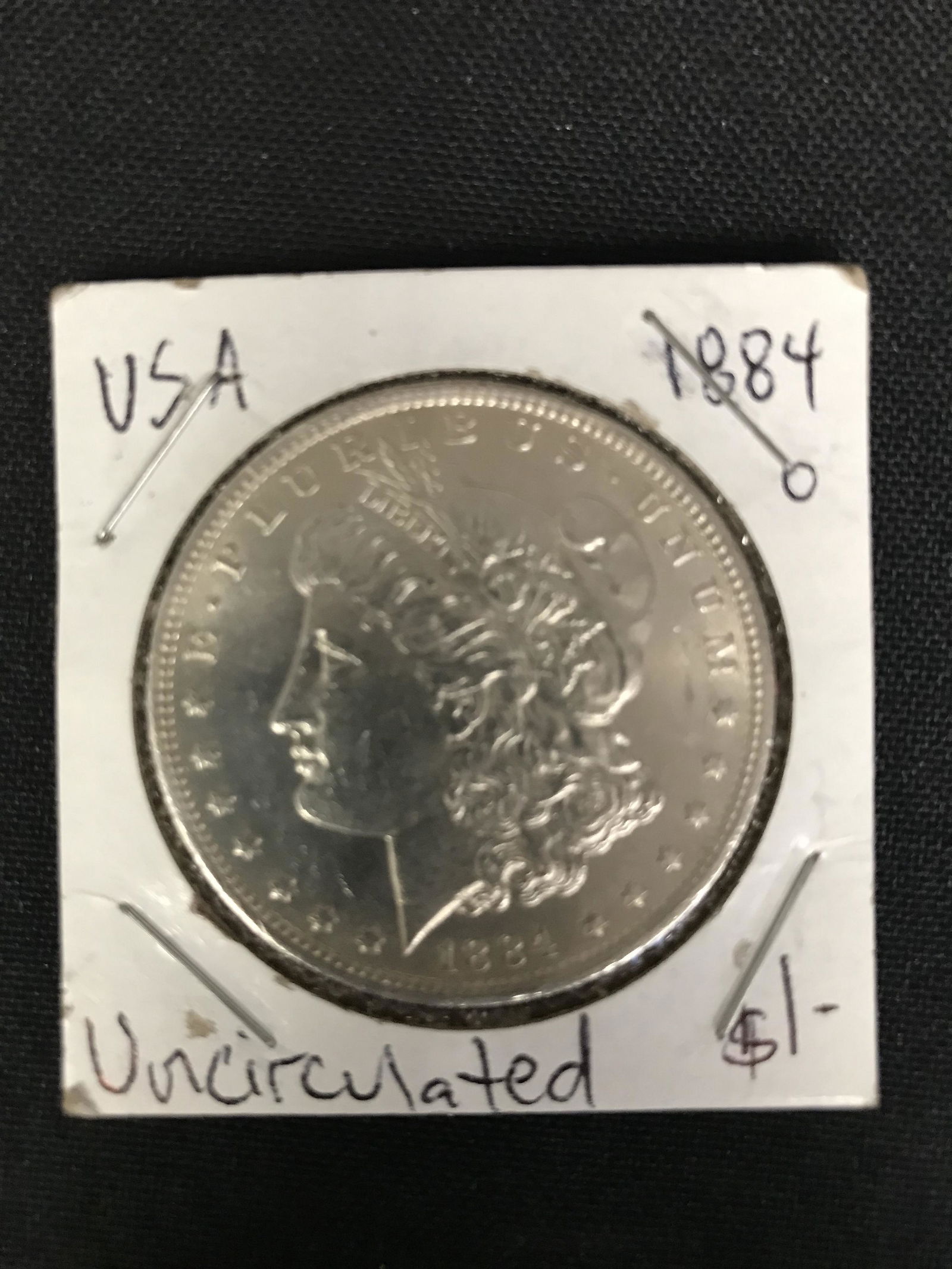1884 USA MORGAN SILVER DOLLAR (NEW ORLEANS MINTED) Unci (1 of 1)