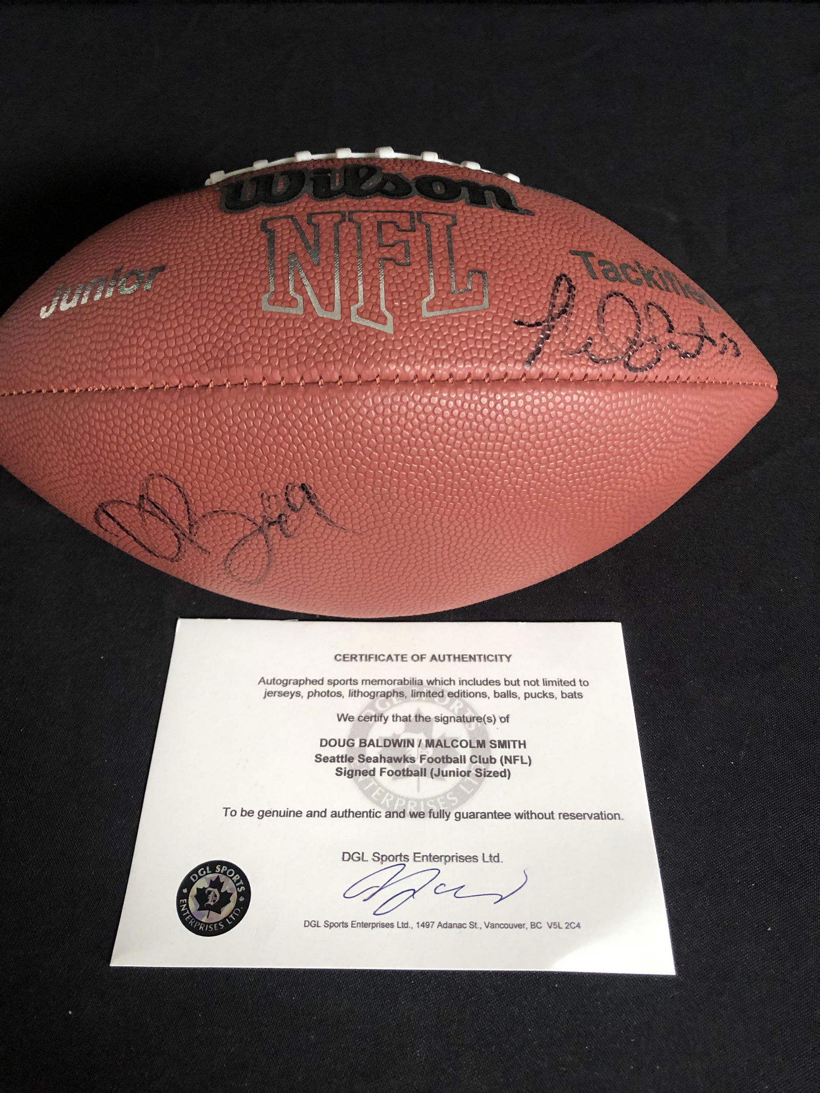 SUPER BOWL MVP MALCOLM SMITH AND DOUG BALDWIN SIGNED WILSON FOOTBALL (DGL SPORTS COA) (1 of 2)