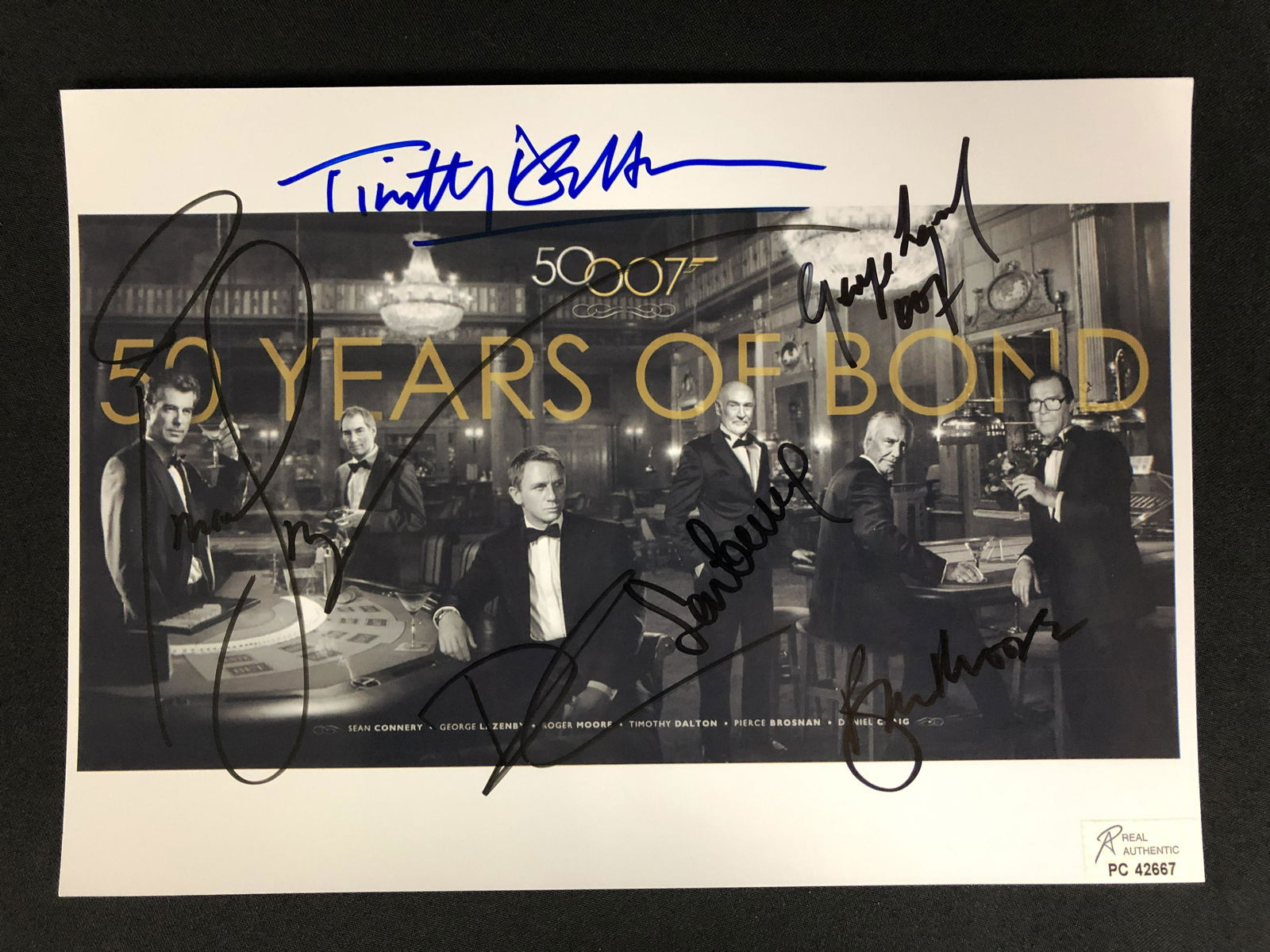 50 YEARS OF JAMES BOND SIGNED 8 X 10 (ALL JAMES BONDS) RA COA (1 of 2)