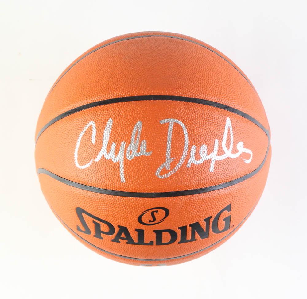 CLYDE DREXLER SIGNED SPALDING BASKETBALL (JSA COA) (1 of 2)