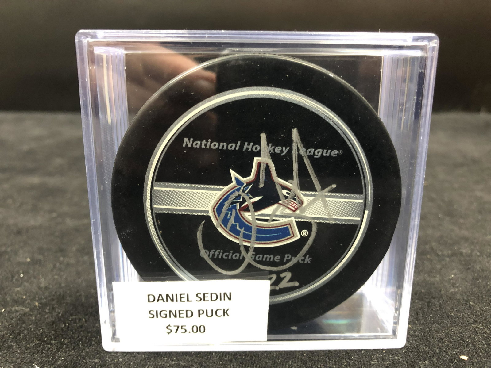 DANIEL SEDIN SIGNED VANCOUVER CANUCKS HOCKEY PUCK (GCG COA: DANIEL SEDIN SIGNED VANCOUVER CANUCKS HOCKEY PUCK (GCG COA