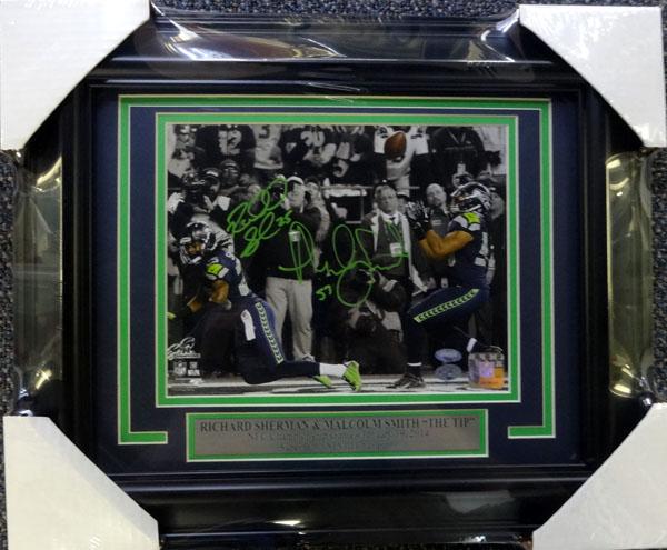 RICHARD SHERMAN AND MALCOLM SMITH DUAL SIGNED AND FRAMED 8 X 10 (BECKETT COA): RICHARD SHERMAN AND MALCOLM SMITH DUAL SIGNED AND FRAMED 8 X 10 (BECKETT COA)