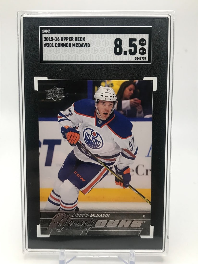 201516 UPPER DECK CONNOR MCDAVID YOUNG GUNS ROOKIE CARD (SGC 8.5) (1 of 2)