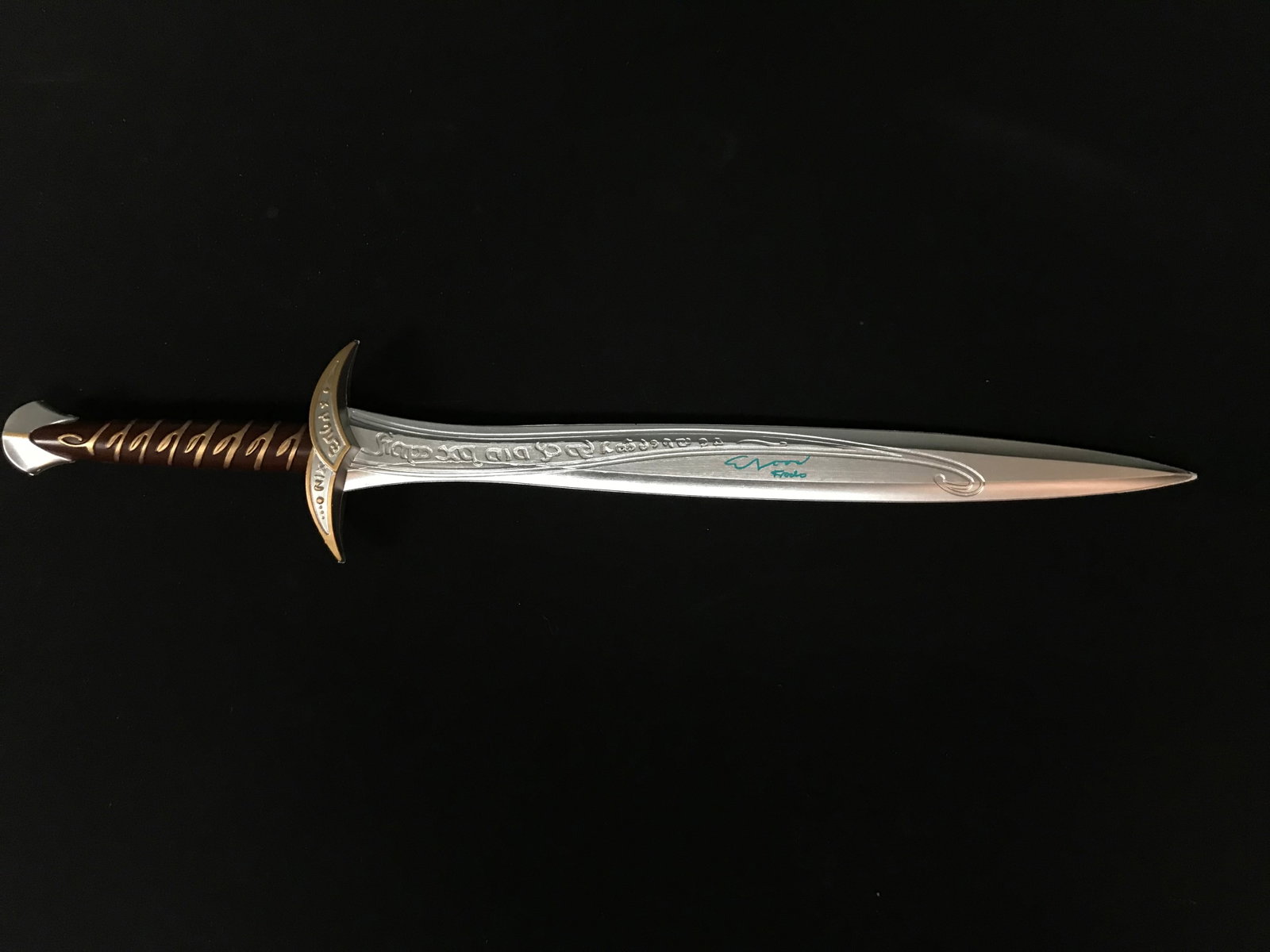 ELIJAH WOOD SIGNED AND INSCRIBED LOTR STING SWORD (WWOC COA): Prices are in Canadian dollars