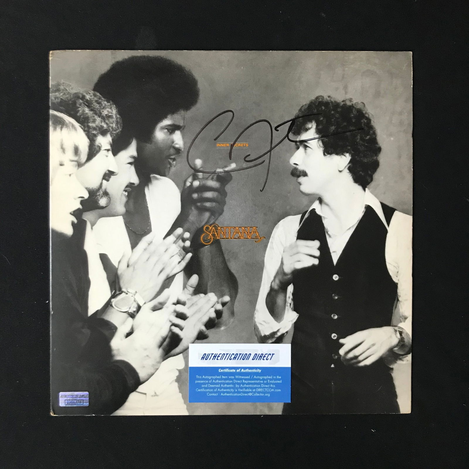 CARLOS SANTANA SIGNED ALBUM (AUTHENTICATION DIRECT COA) & KENNY ROGERS SIGNED ALBUM (GA AUTO COA) (1 of 2)