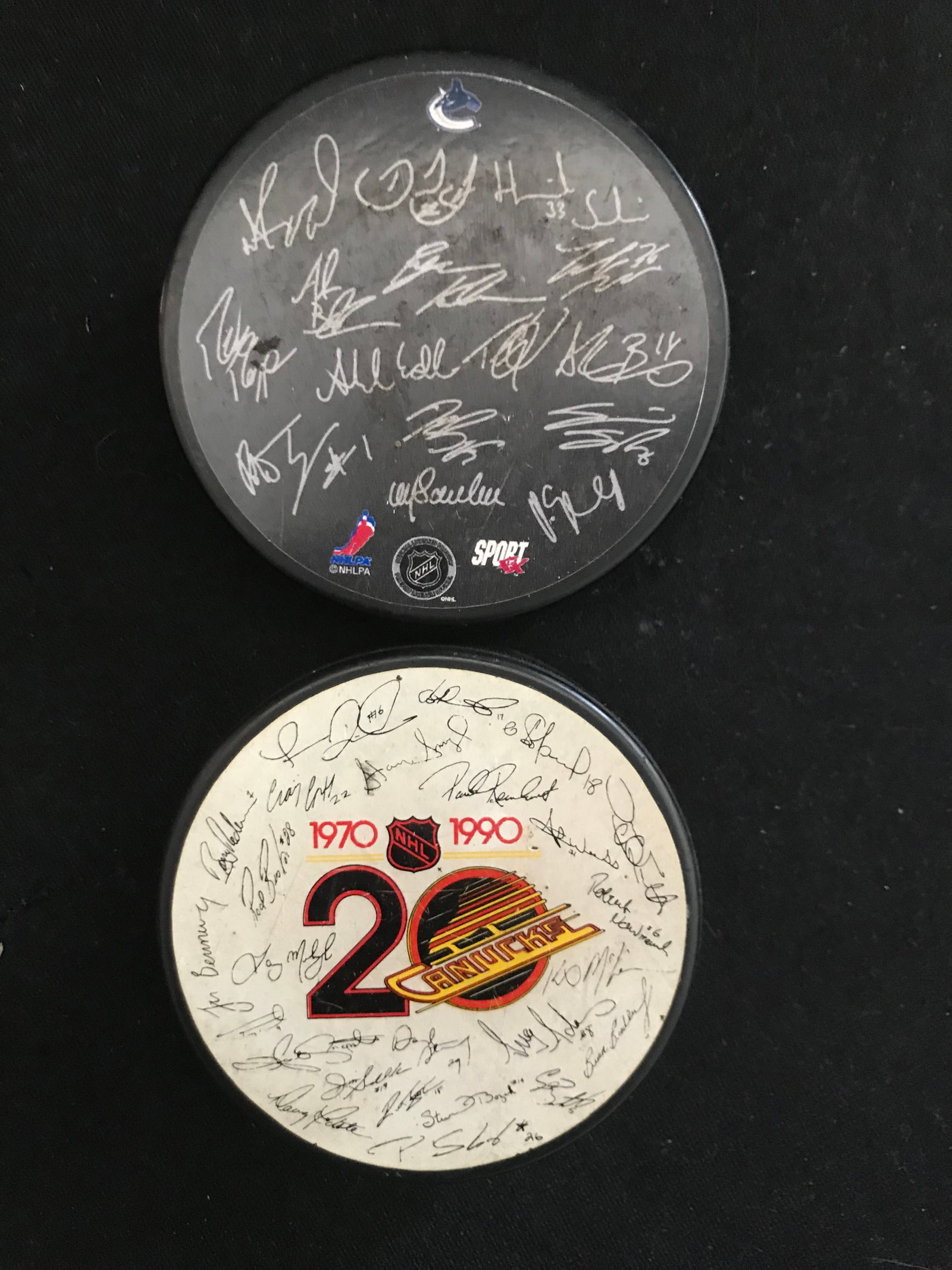 2 VINTAGE VANCOUVER CANUCKS TEAM COLLECTOR PUCKS: Prices are in Canadian dollars