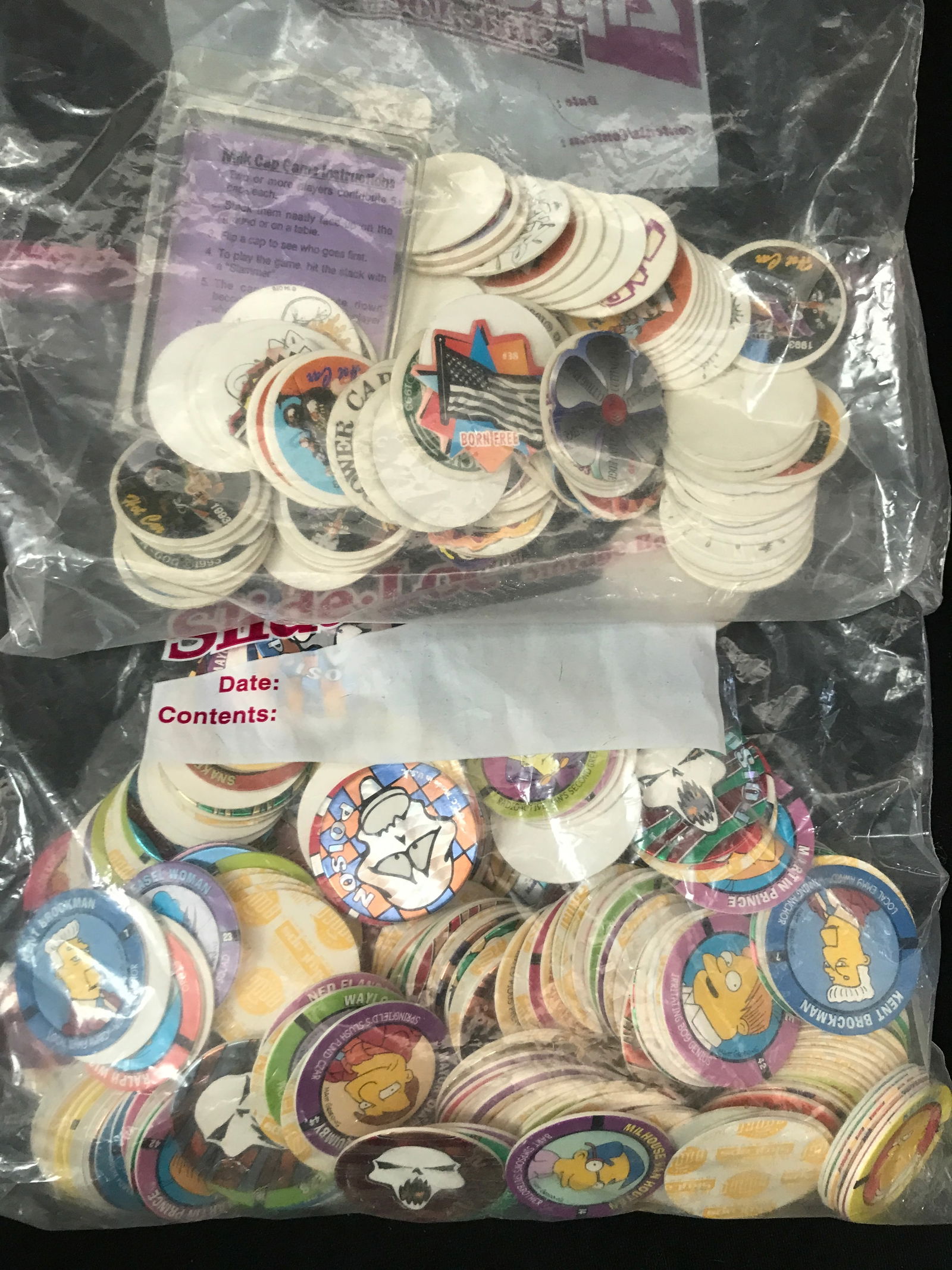 LARGE LOT OF VINTAGE POGS (SIMPSONS): Prices are in Canadian Dollars