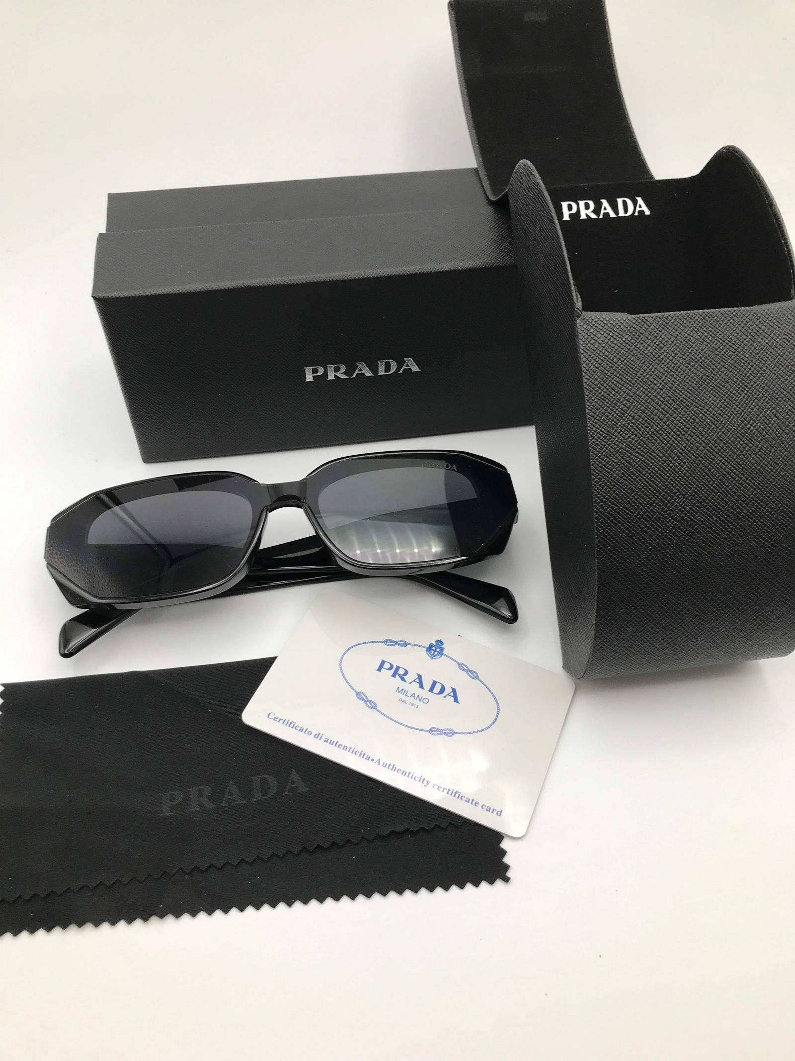 BRAND NEW PRADA SUNGLASSES WITH CASE AND BOX: Prices are in Canadian dollars