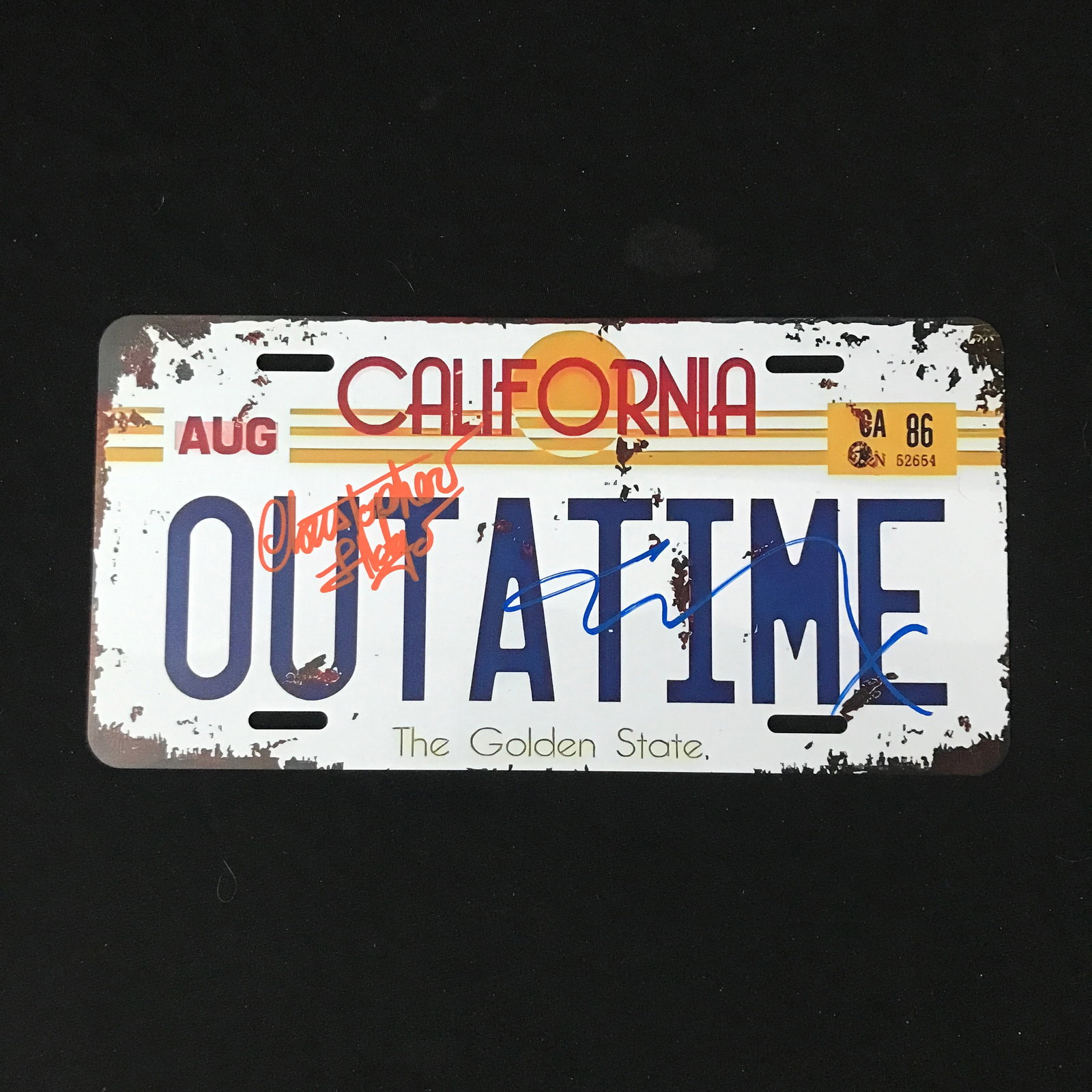CHRISTOPHER LLOYD AND MICHAEL J FOX DUAL SIGNED LICENSE PLATE - WWOC COA: Prices are in Canadian dollars