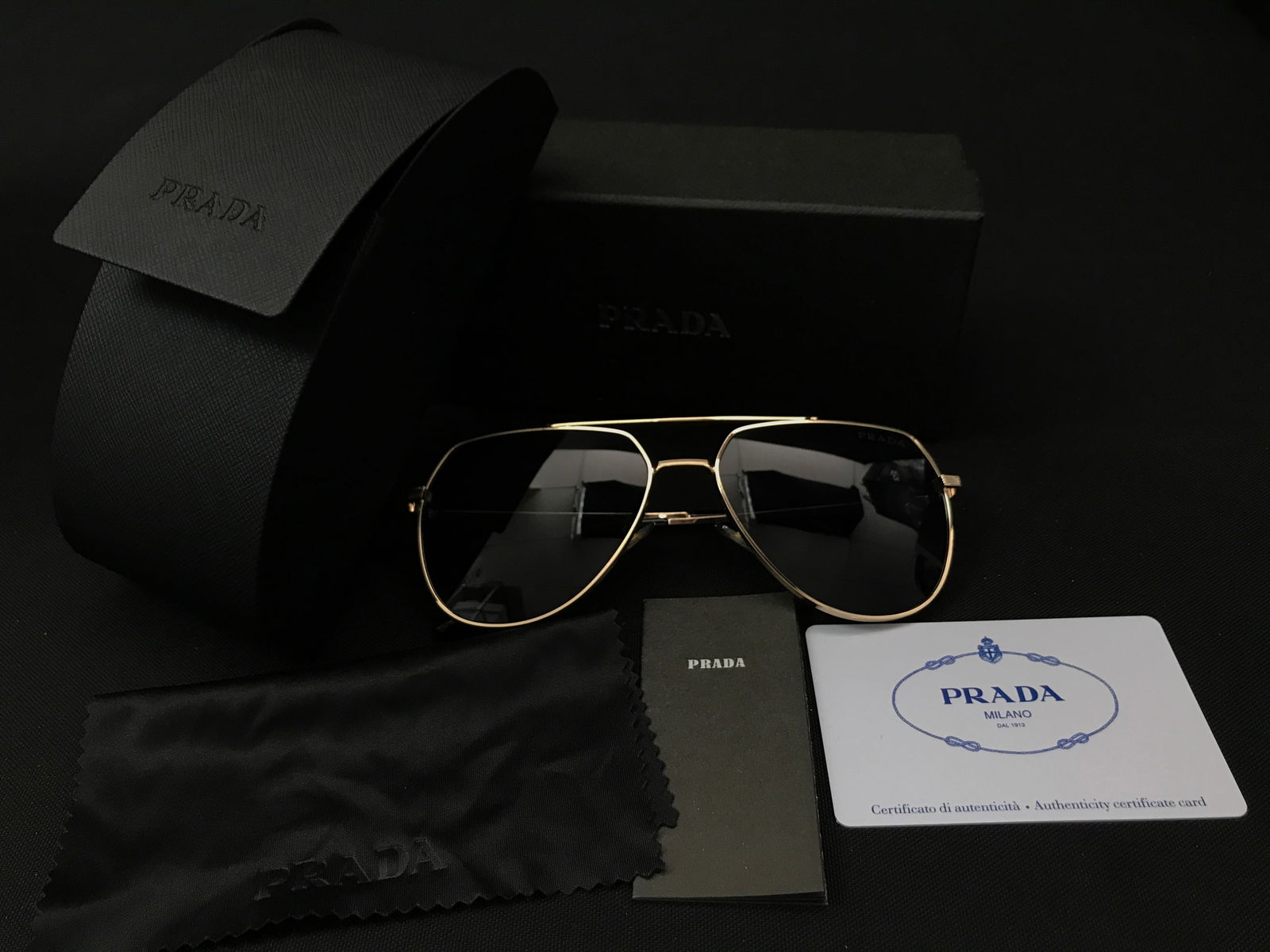 BNIB PRADA SUNGLASSES WITH BOX AND ACCESSORIES: Prices are in Canadian dollars