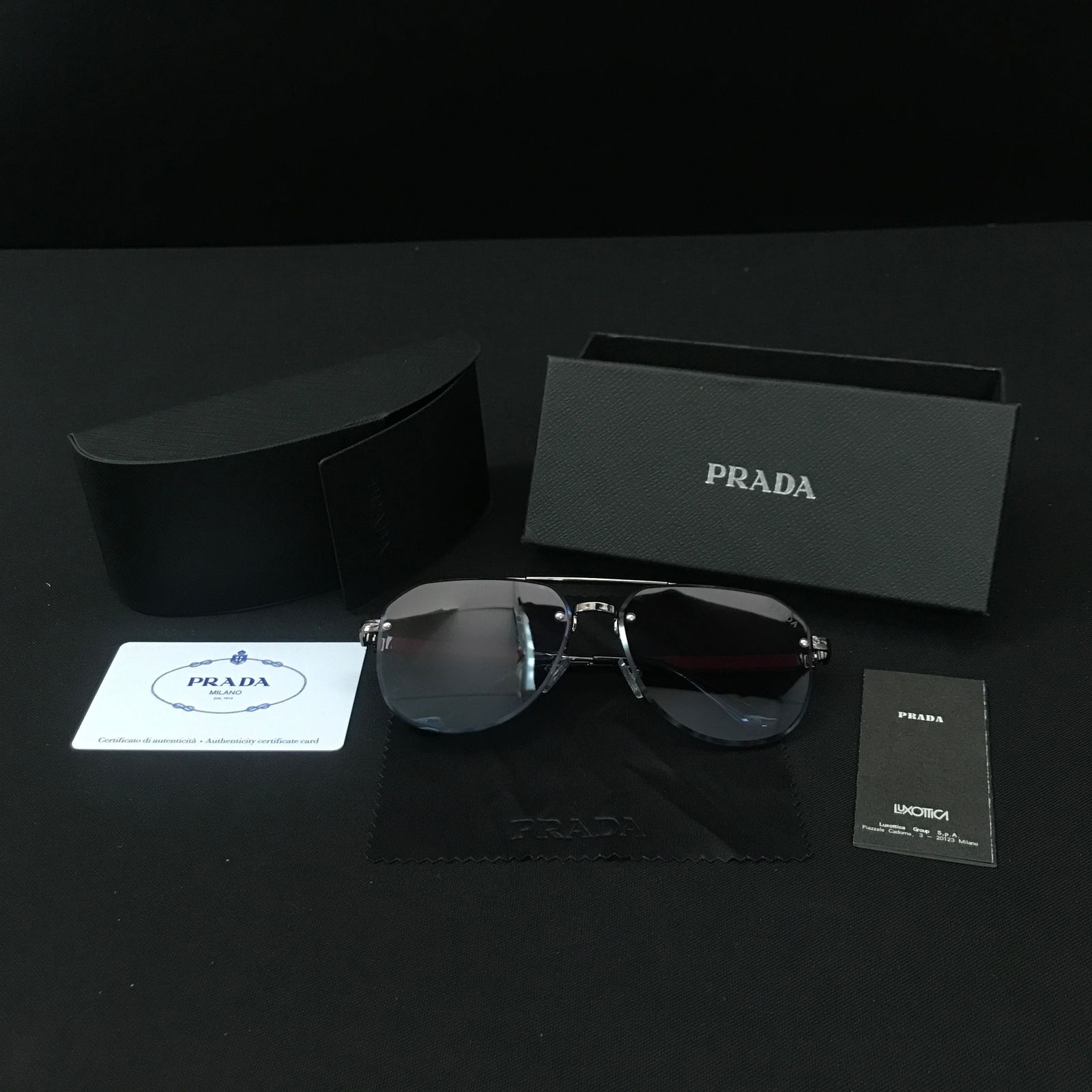 BNIB PRADA SUNGLASSES WITH BOX AND ACCESSORIES: Prices are in Canadian dollars