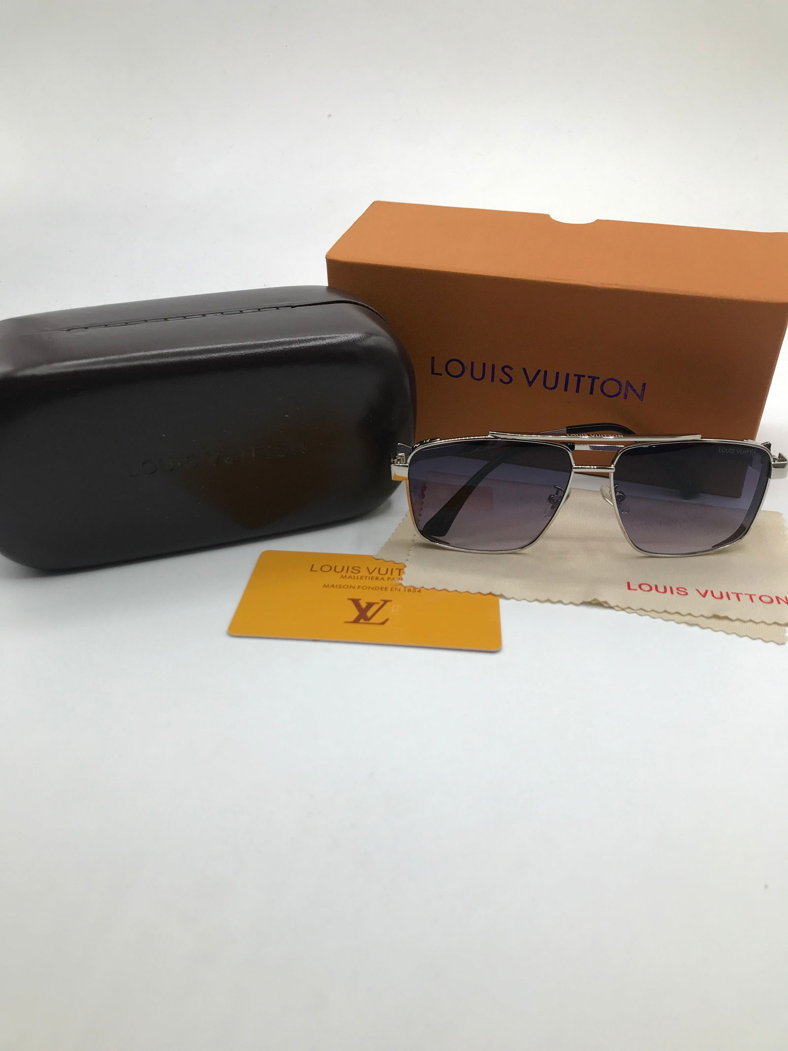 BRAND NEW SUNGLASSES WITH BOX AND ACCESSORIES: Prices are in Canadian dollars