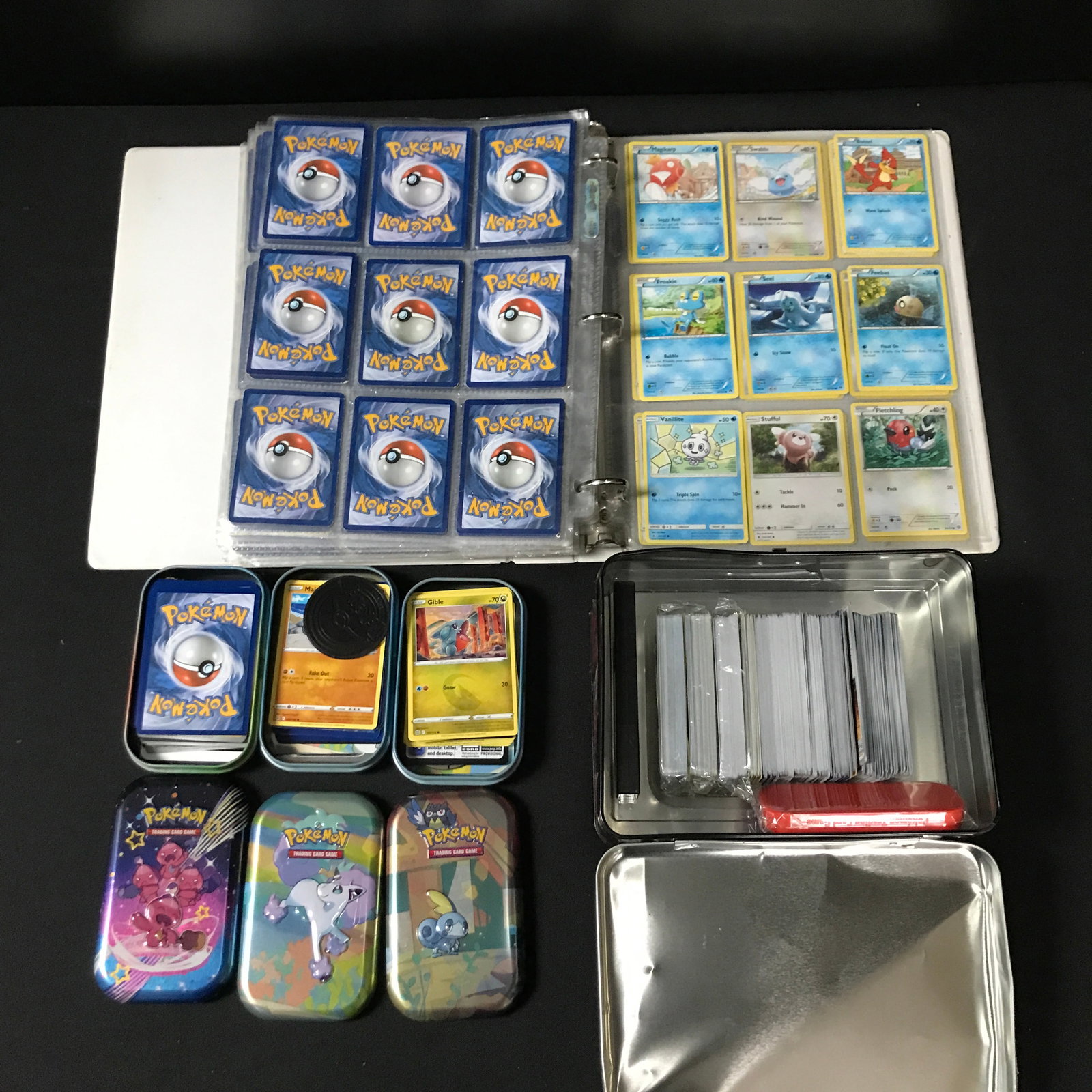 LOT OF POKEMON TCG TRADING CARDS INCLUDING 2 BINDERS AND 6 TINS: Prices are in Canadian dollars