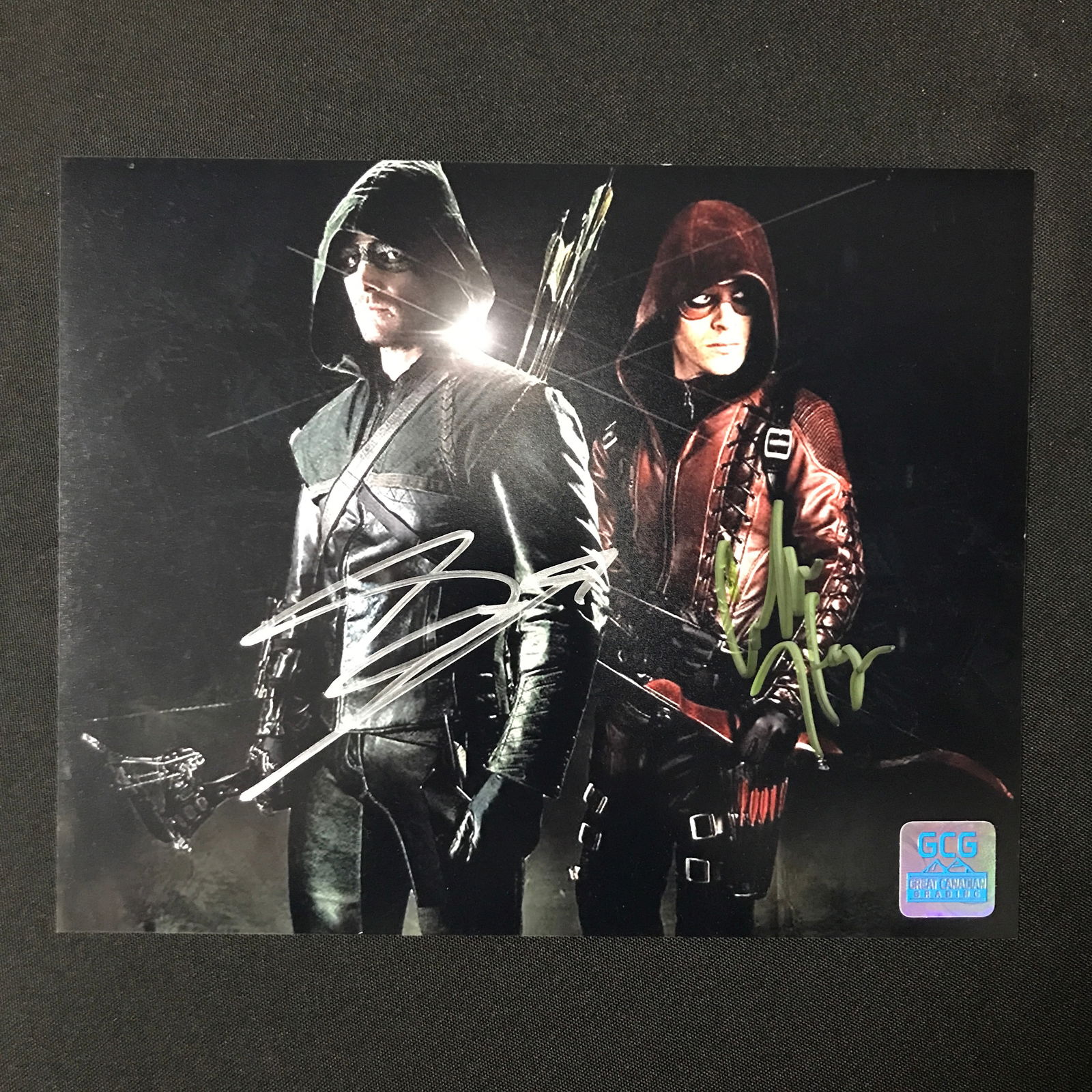 STEPHEN AMELL AND COLTON HAYNES DUAL SIGNED 8X10 - GCG COA: Prices are in Canadian dollars