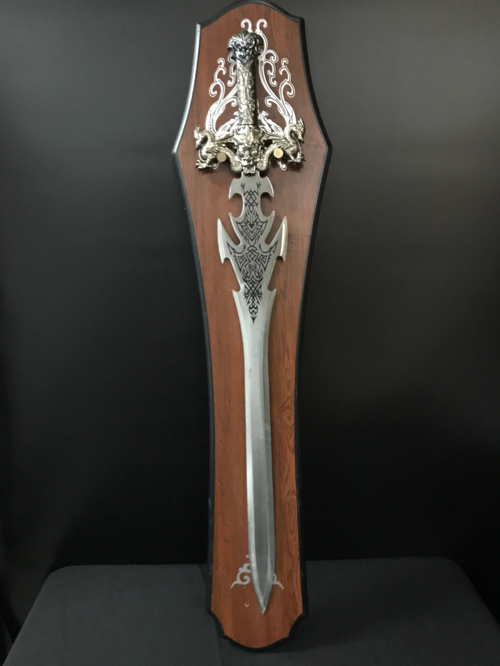 LARGE METAL SWORD ON WOODEN BACKING (NOT SIGNED): Prices are in Canadian dollars