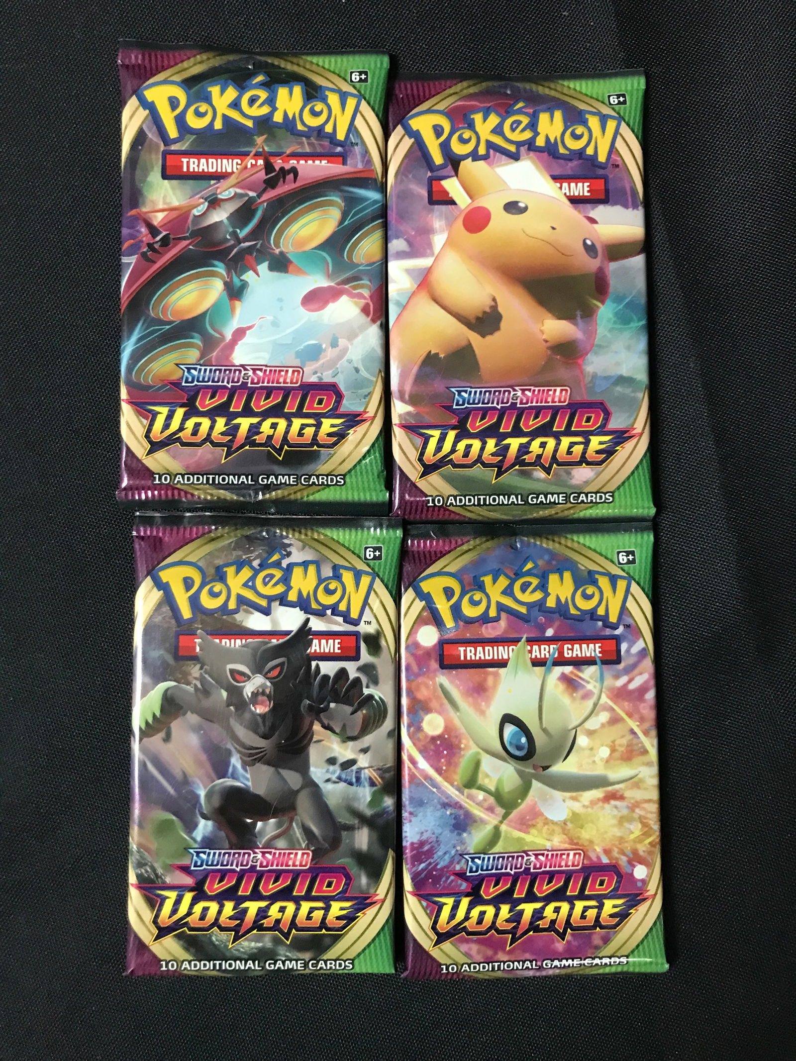 LOT OF 4 POKEMON TCG SWORD AND SHIELD VIVID VOLTAGE SEAKLED BOOSTER PACKS (1 of 1)