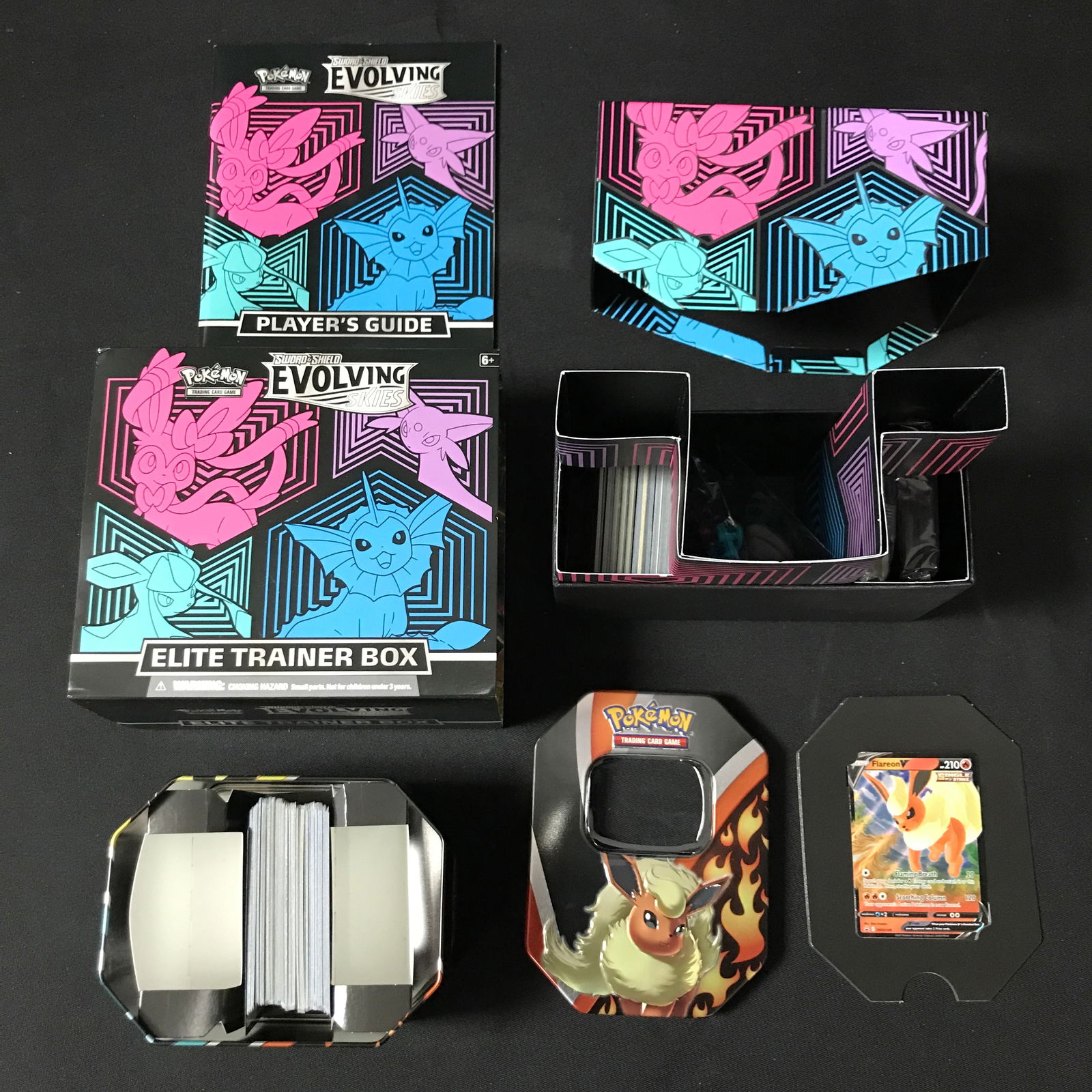 POKEMON TCG SWORD AND SHIELD EVOLVING SKIES ETB AND POKEMON TCG TIN: Prices are in Canadian dollars