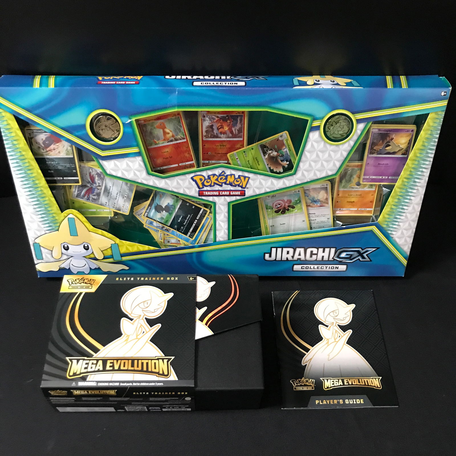 LOT OF POKEMON COLLECTIBLES INCLUDING MEGA EVOLUTION BOX AND PLAYER GUIDE (1 of 1)