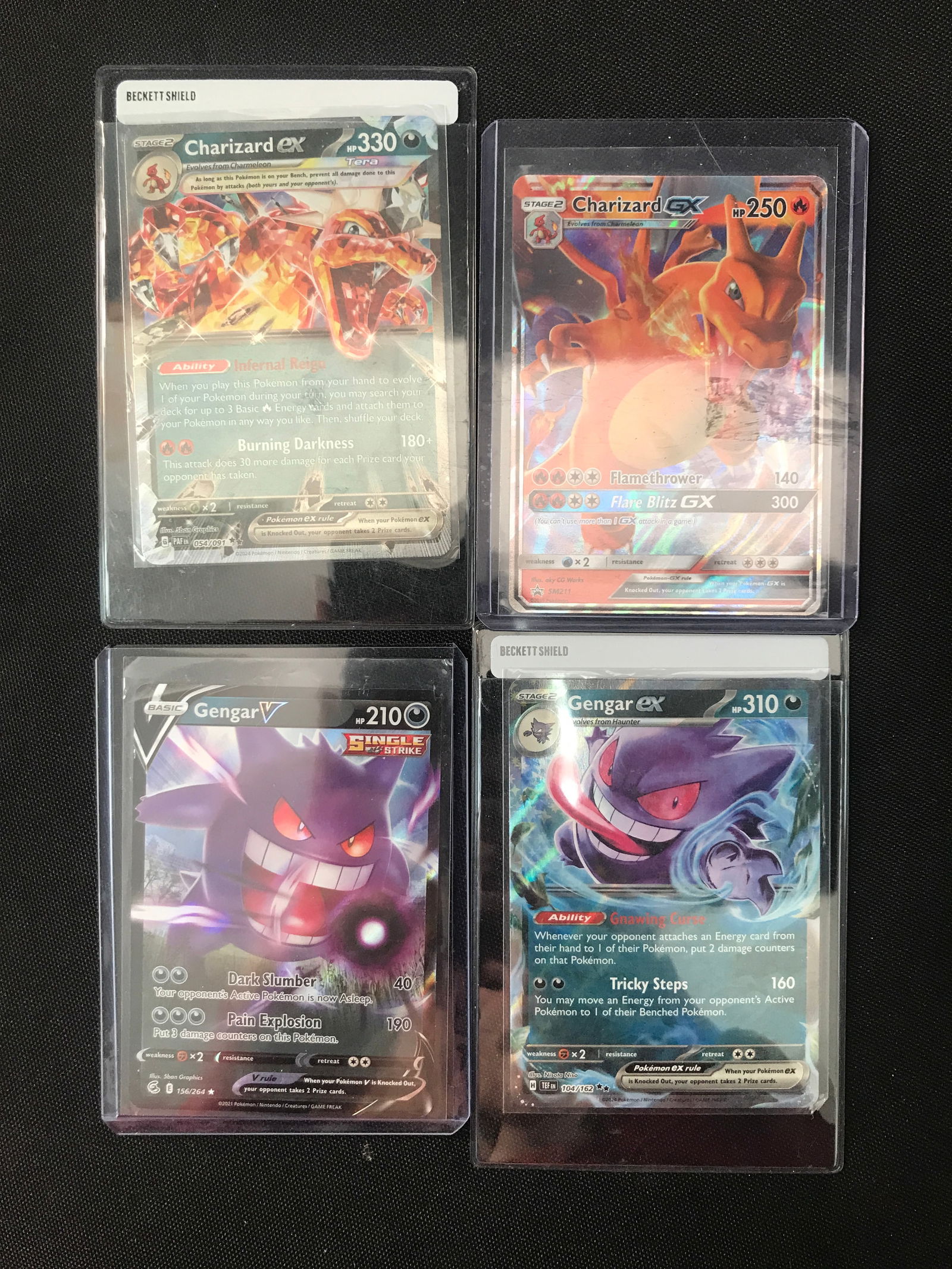 LOT OF 4 POKEMON TCG TRADING CARDS INCLUDING 2X CHARIZARD CARDS (1 of 1)