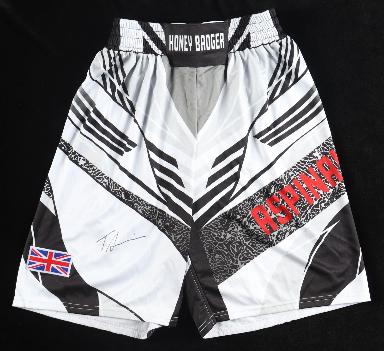 TOM ASPINALL SIGNED HONEY BADGER FIGHT SHORTS - BECKETT COA: Prices are in Canadian dollars