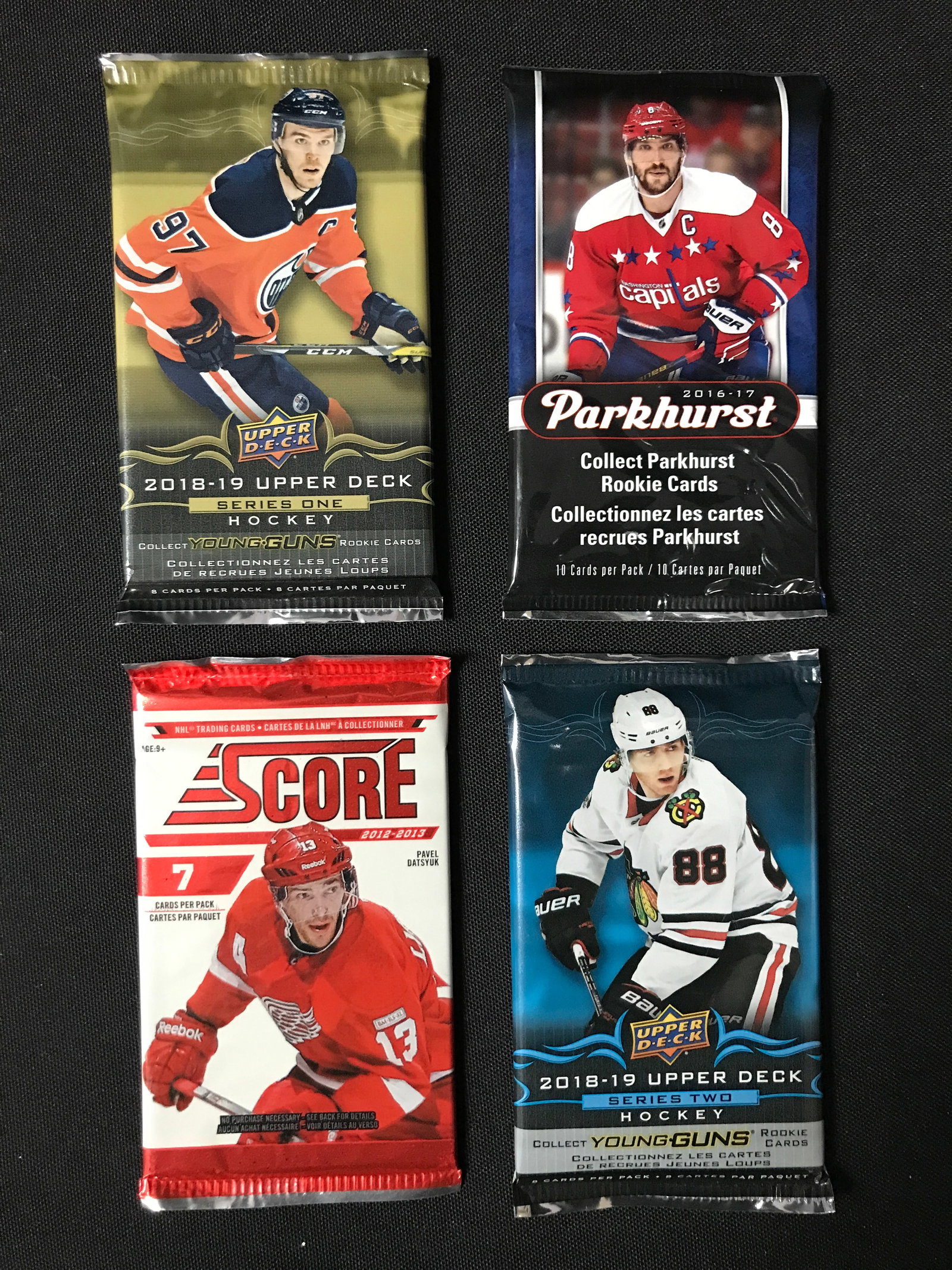 LOT OF 4 SEALED NHL HOCKEY CARD PACKS (VARIOUS YEARS): Prices are in Canadian dollars