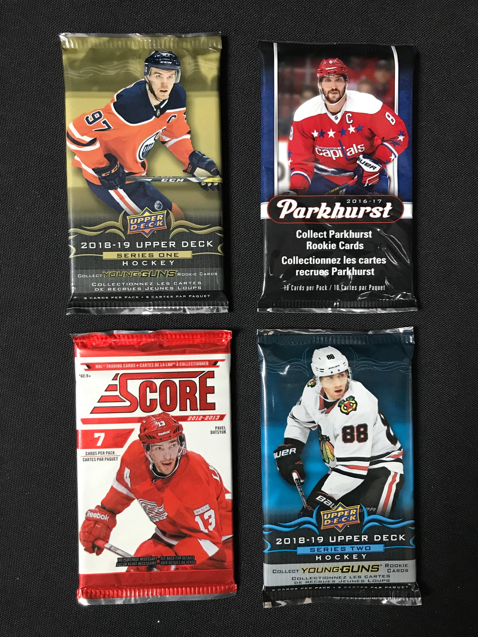 LOT OF 4 SEALED NHL HOCKEY CARD PACKS (VARIOUS YEARS): Prices are in Canadian dollars