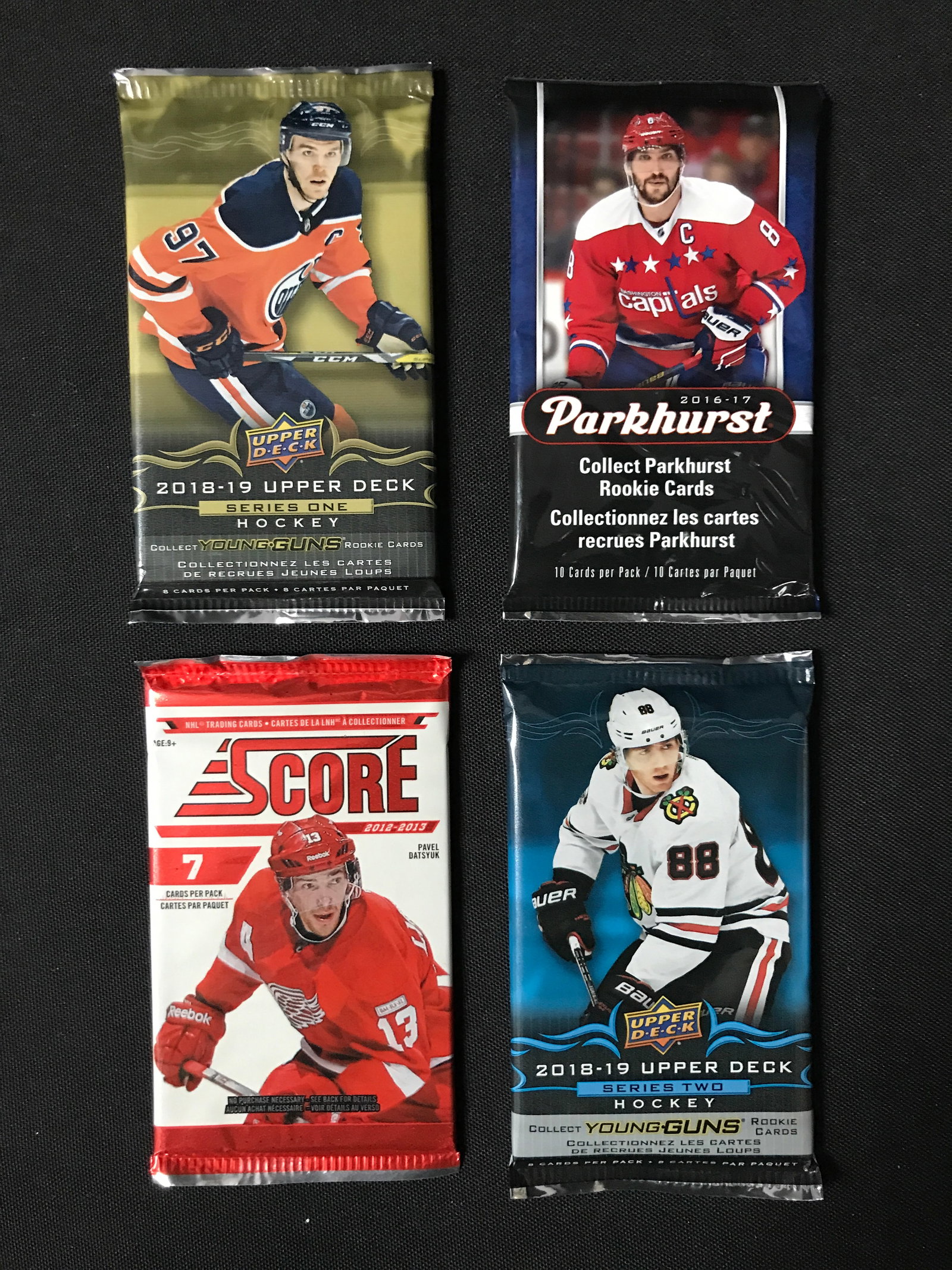 LOT OF 4 SEALED NHL HOCKEY CARD PACKS (VARIOUS YEARS): Prices are in Canadian dollars