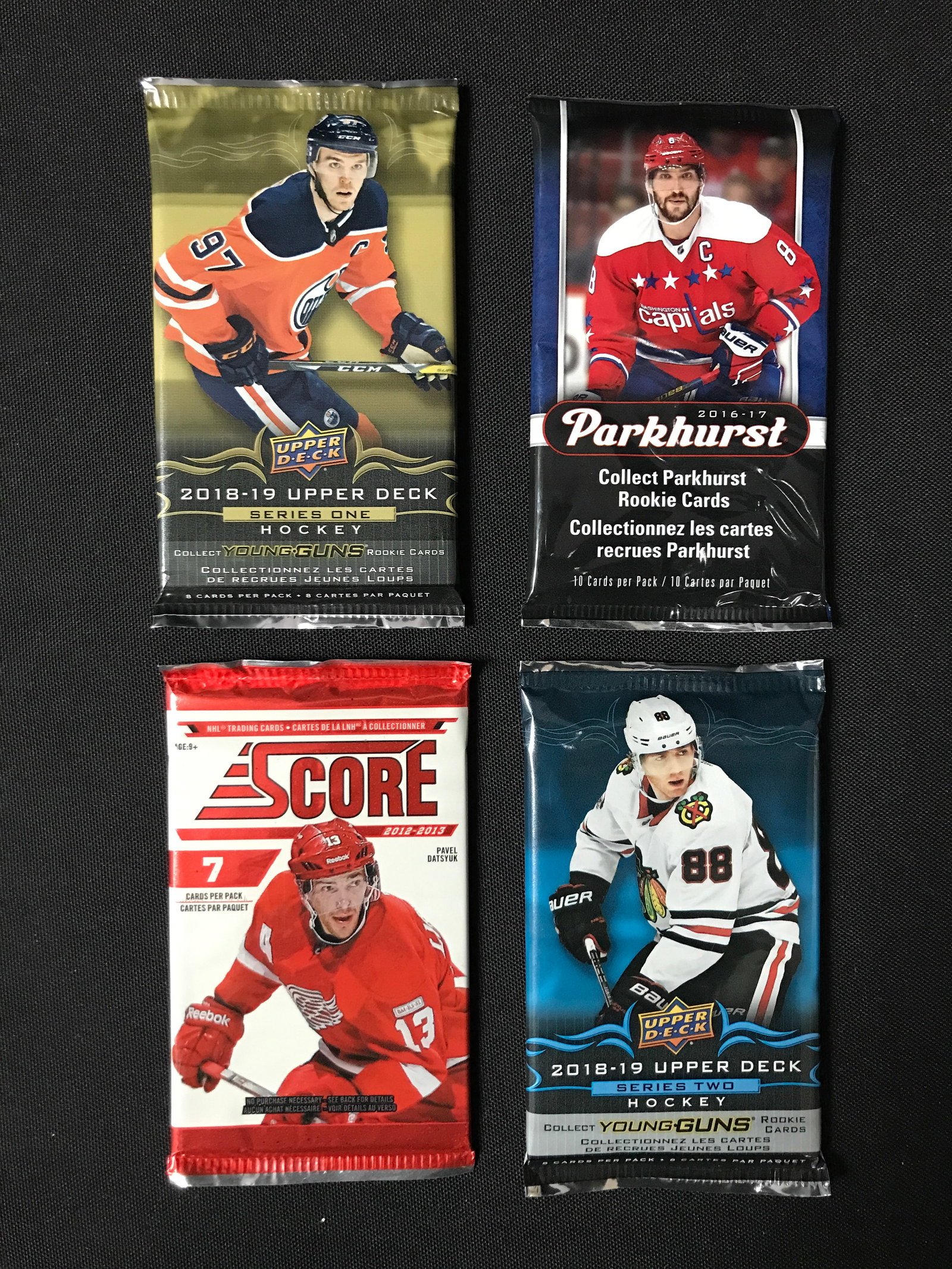 LOT OF 4 SEALED NHL HOCKEY CARD PACKS (VARIOUS YEARS): Prices are in Canadian dollars