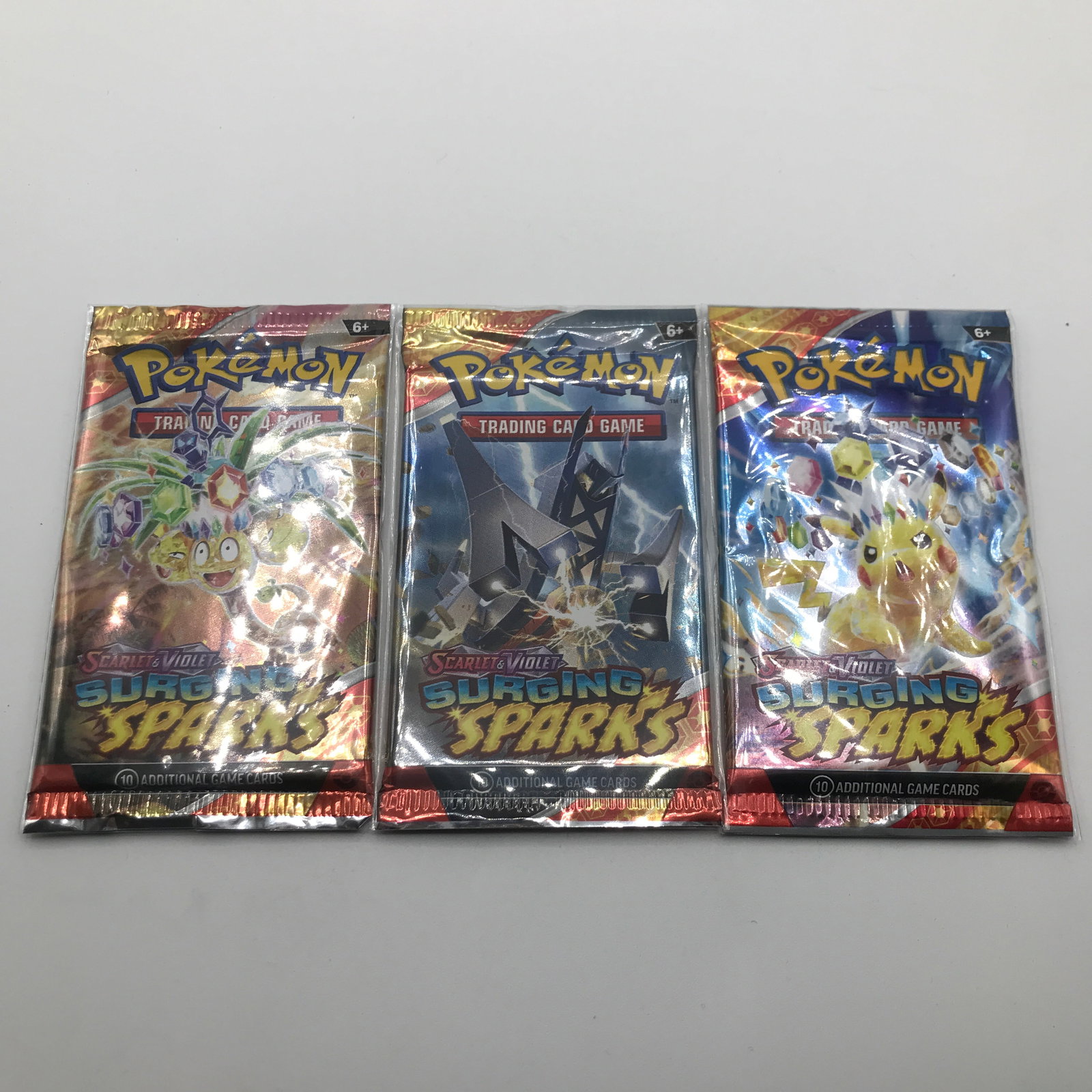 LOT OF 3 POKEMON TCG SCARLET & VIOLET SURGING SPARKS SEALED BOOSTER PACKS: Prices are in Canadian dollars