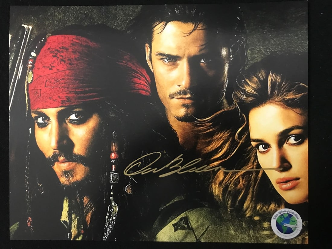ORLANDO BLOOM SIGNED PIRATES OF THE CARIBBEAN 8X10 - WWOC COA: Prices are in Canadian dollars