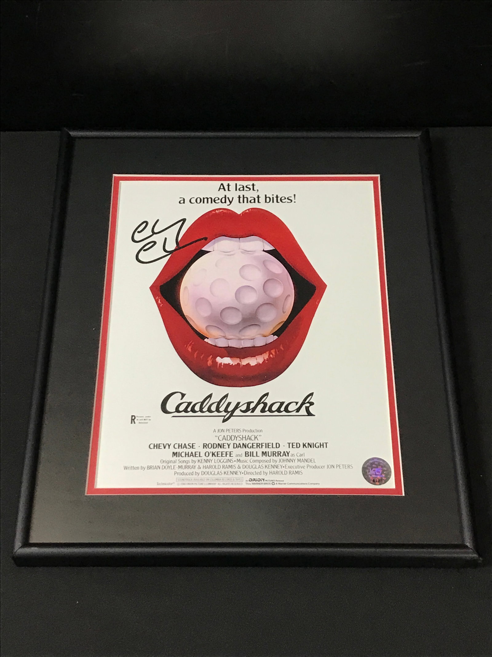 CHEVY CHASE SIGNED AND FRAMED CADDYSHACK 8X10 - KB COA: Prices are in Canadian dollars