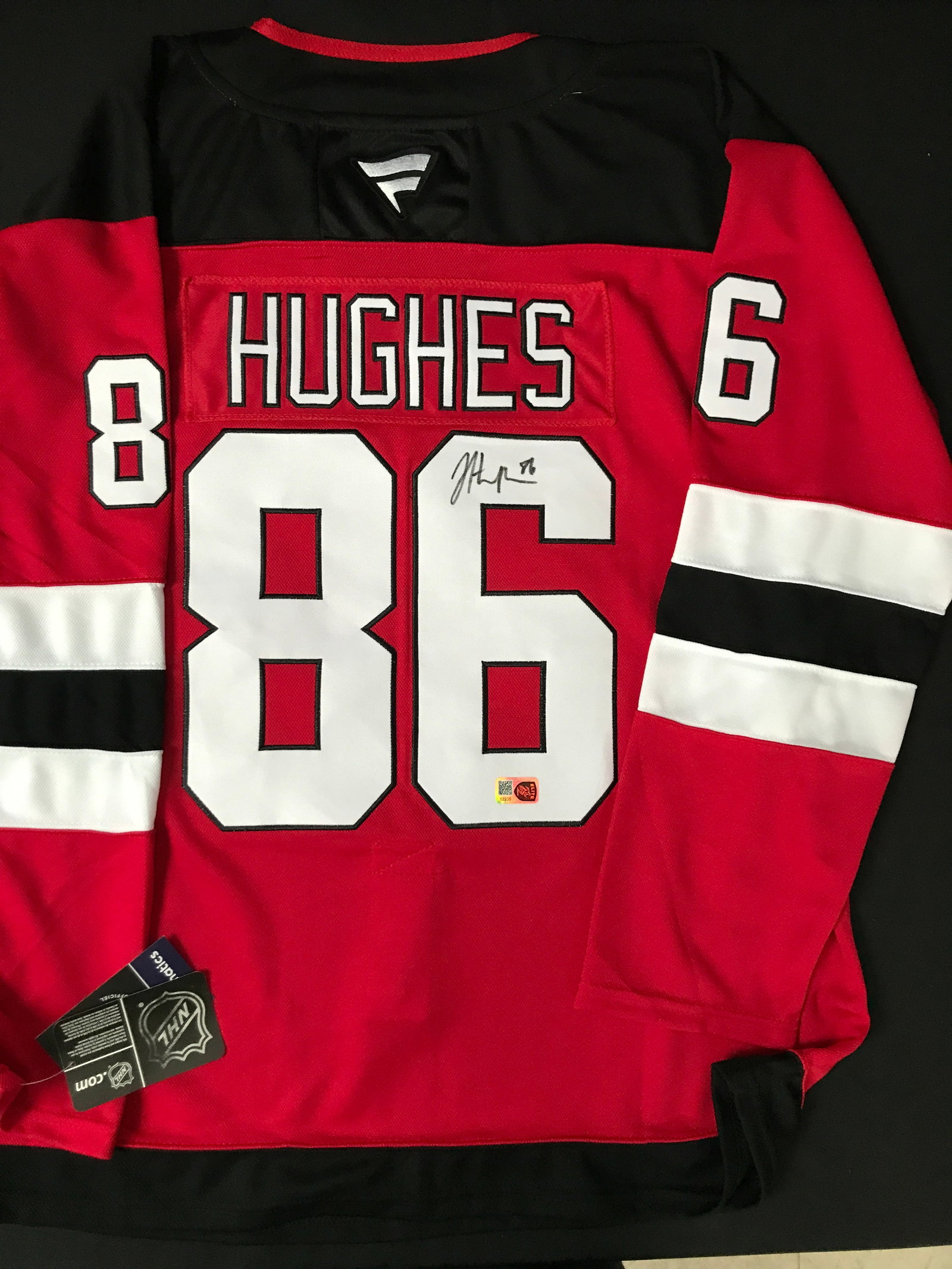 JACK HUGHES SIGNED NEW JERSEY DEVILS CUSTOM JERSEY - ELITE SPORTS COA: Prices are in Canadian dollars