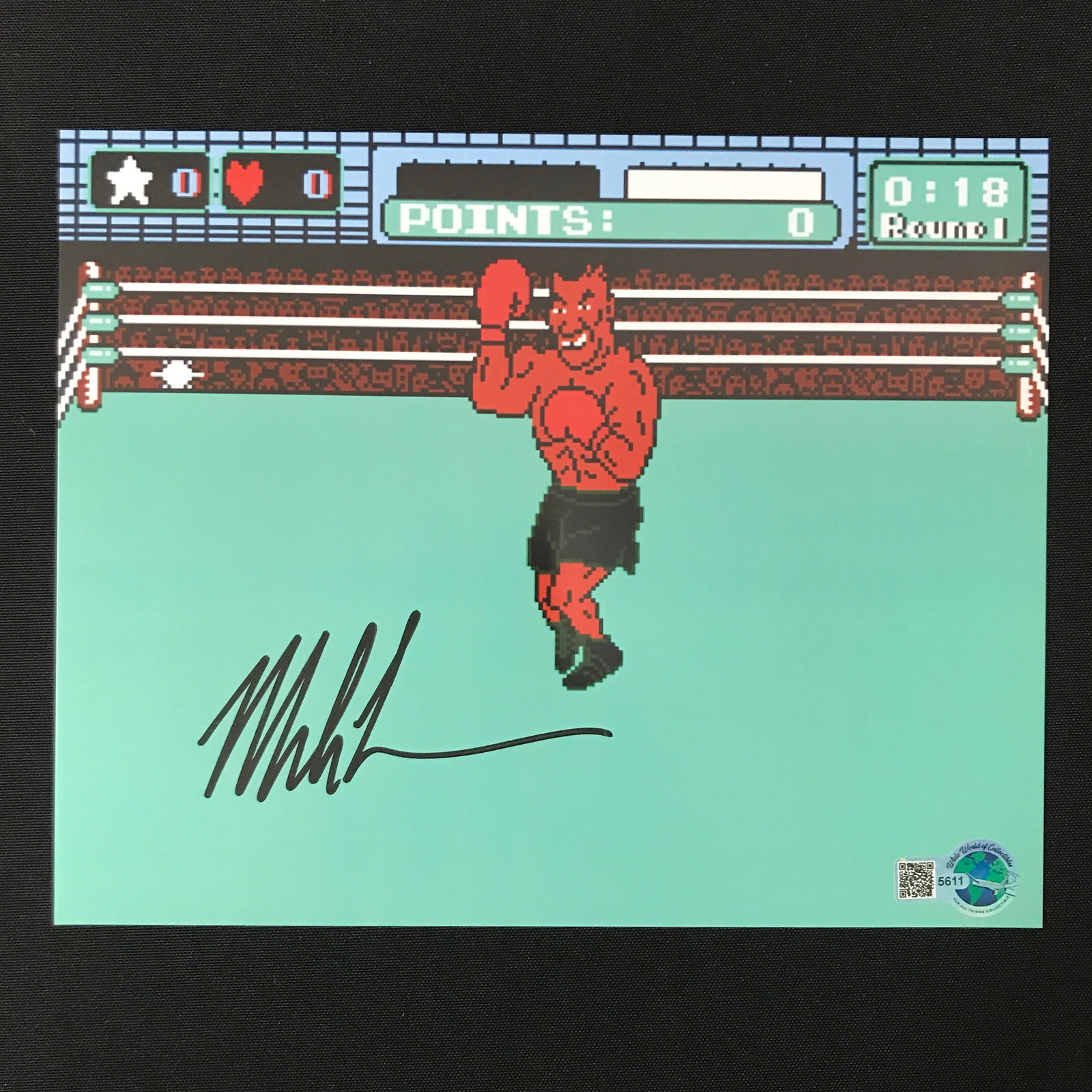 MIKE TYSON SIGNED PUNCH OUT 8X10 - WWOC COA: Prices are in Canadian dollars