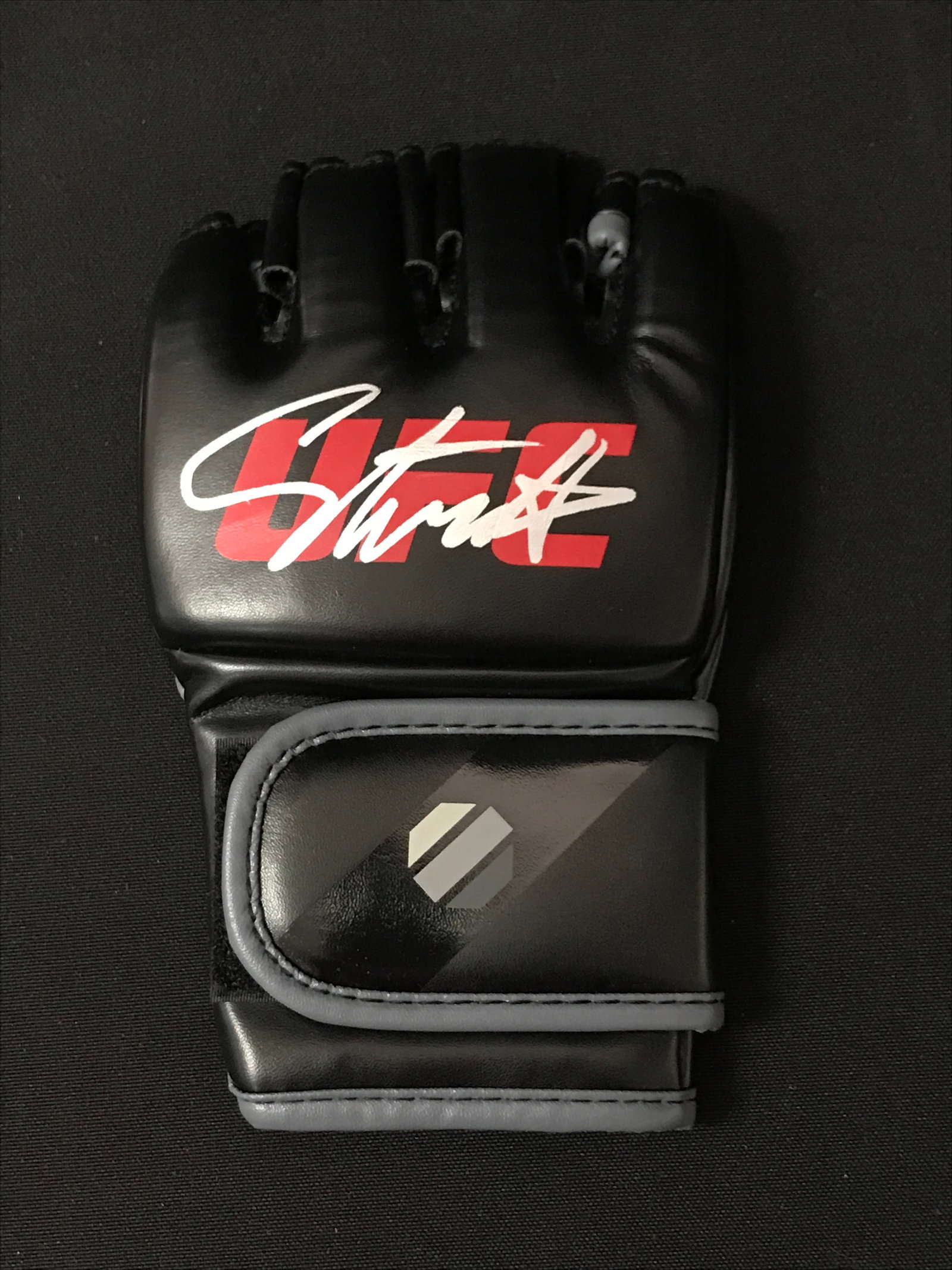 ISRAEL ADESANYA SIGNED UFS GLOVE - BECKETT COA: Prices are in Canadian dollars