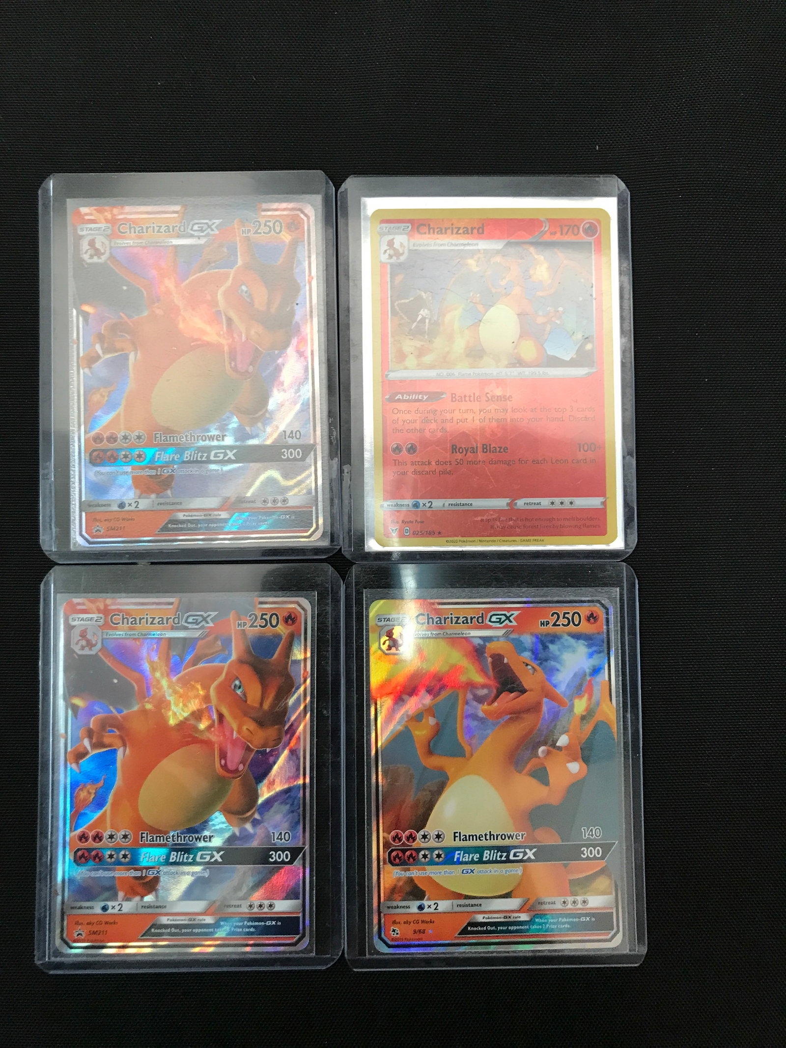 LOT OF 4 POKEMON TCG CHARIZARD TRADING CARDS IN INDIVIDUAL SLEEVES: Prices are in Canadian dollars