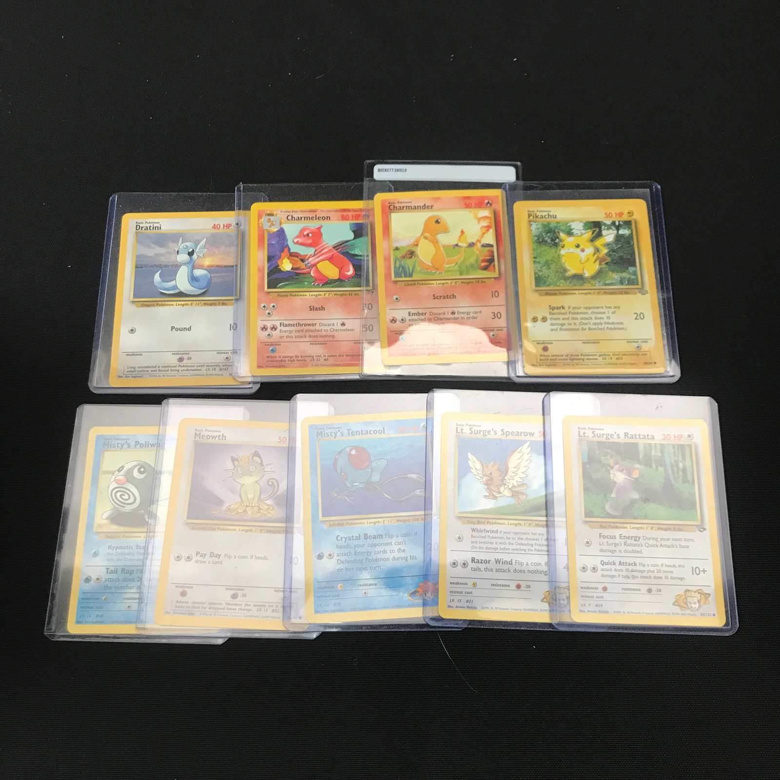 LOT OF 9 POKEMON TCG TRADING CARDS IN SEALED PLASTIC SLEEVES: Prices are in Canadian dollars
