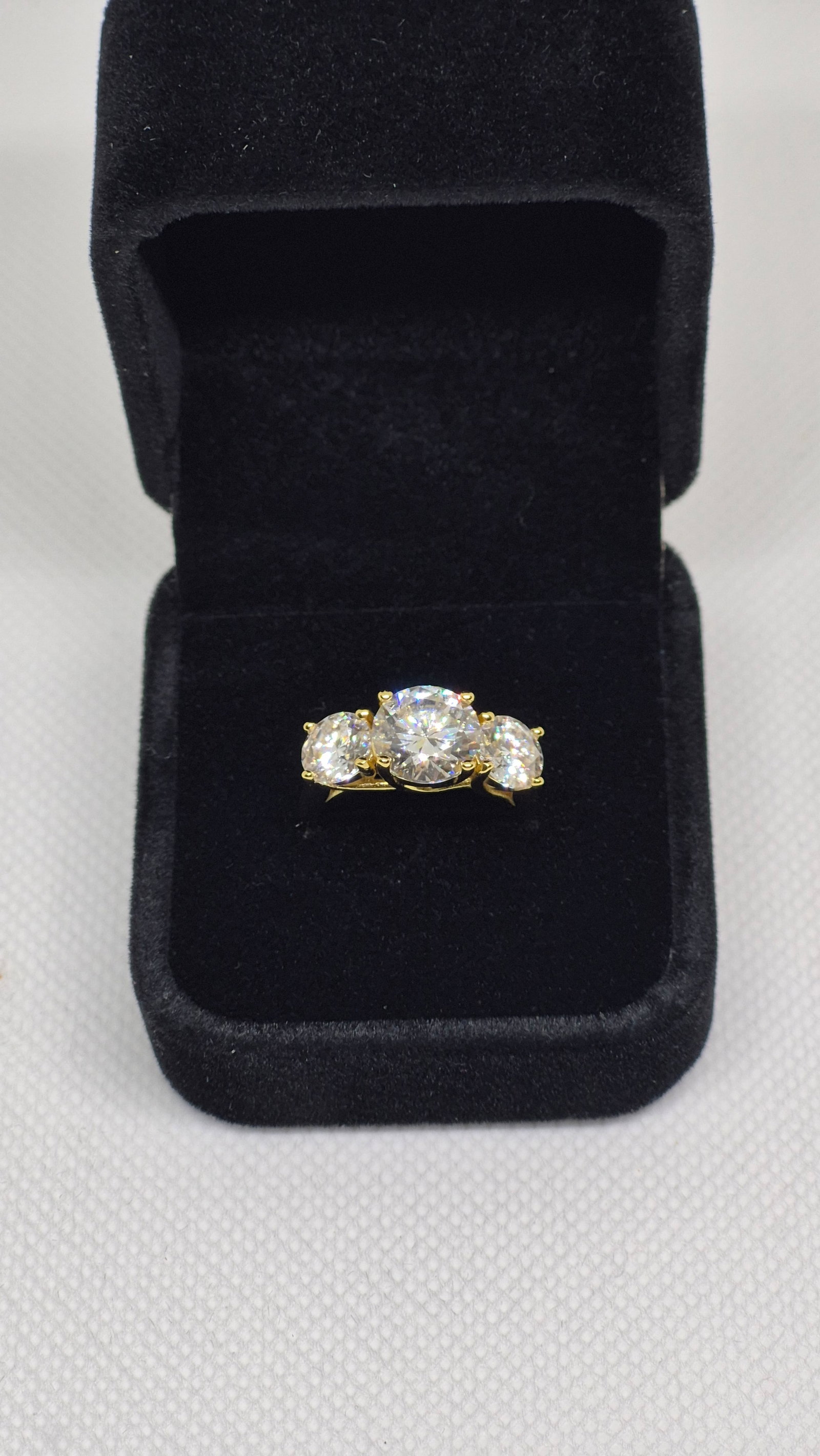 5.0 Carat Infinity 18k Gold Plated Moissanite Ring WITH GRA REPORT: 5.0 Carat Infinity 18k Gold Plated Moissanite Ring1 x 3 Carat Round Cut Moissanite2 x 1 Carat Round Cut MoissaniteAll = VVS1 / D925 Sterling Silver under Gold PlatingAll major stones come with GRA Cer