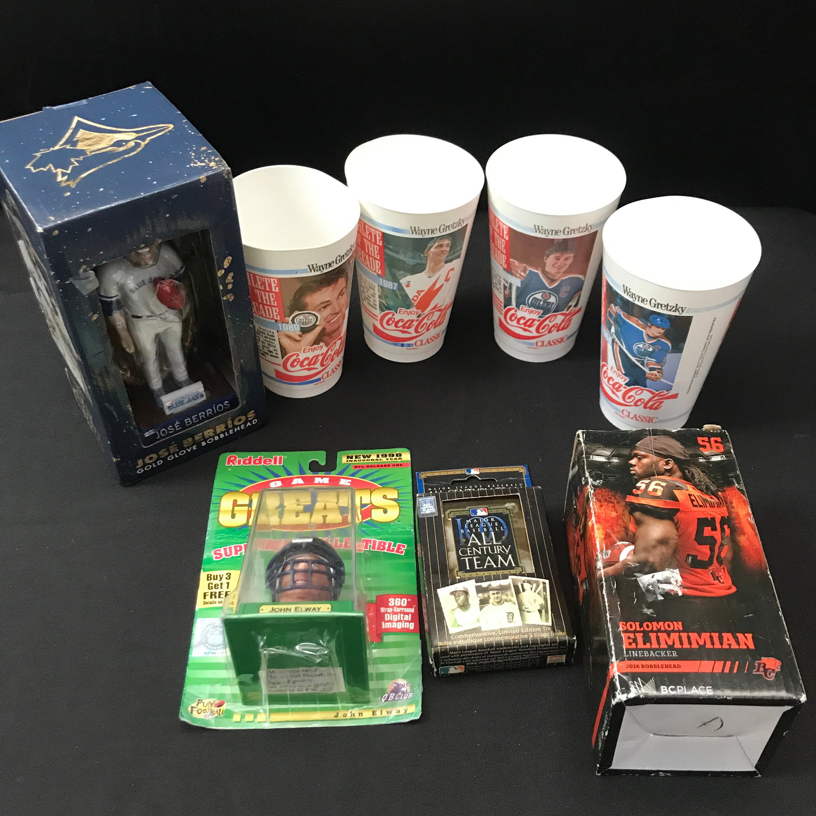 LOT OF SPORTS MEMORABILIA INCLUDING 4 CUPS: Prices are in Canadian dollars