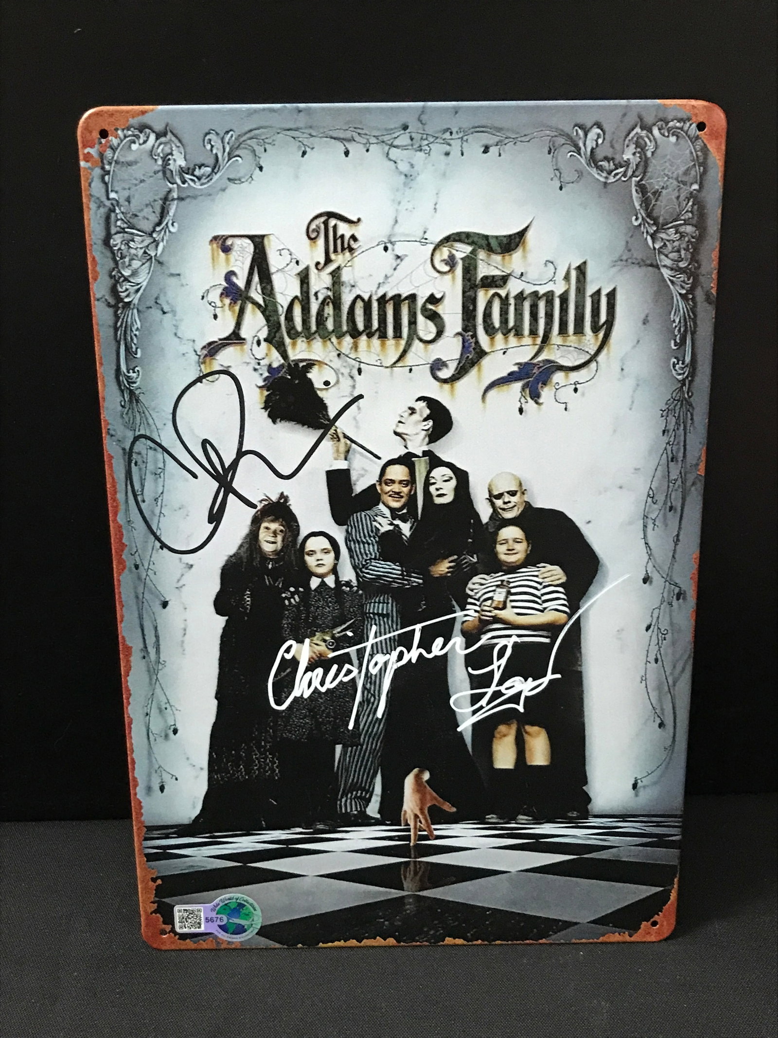 CHRISTINA RICCI AND CHRISTOPHER LLOYD DUAL SIGNED ADDAMS FAMILY TIN SIGN (1 of 1)