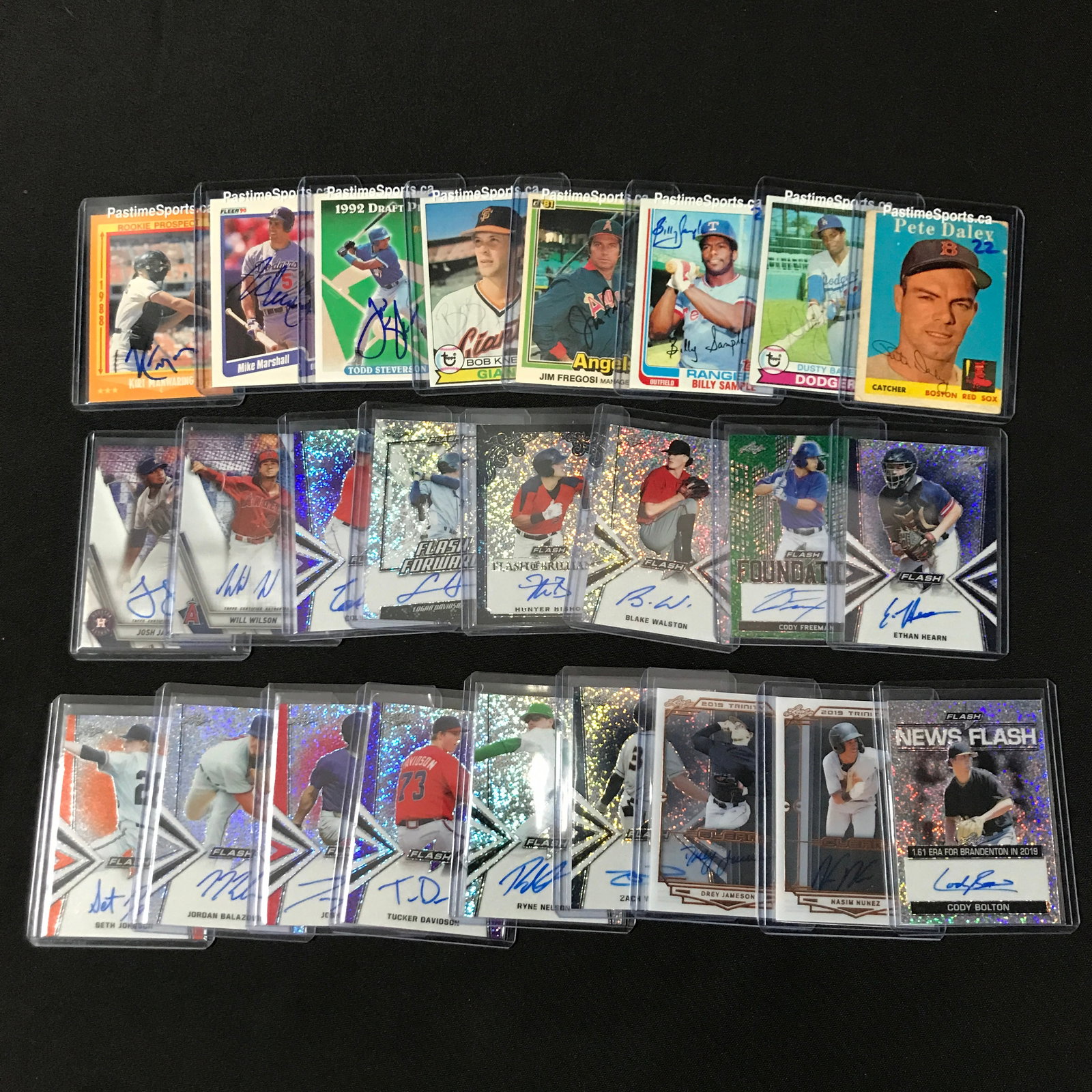 LARGE LOT OF SIGNED BASEBALL TRADING CARDS IN INDIVIDUAL SLEEVES: Prices are in Canadian dollars