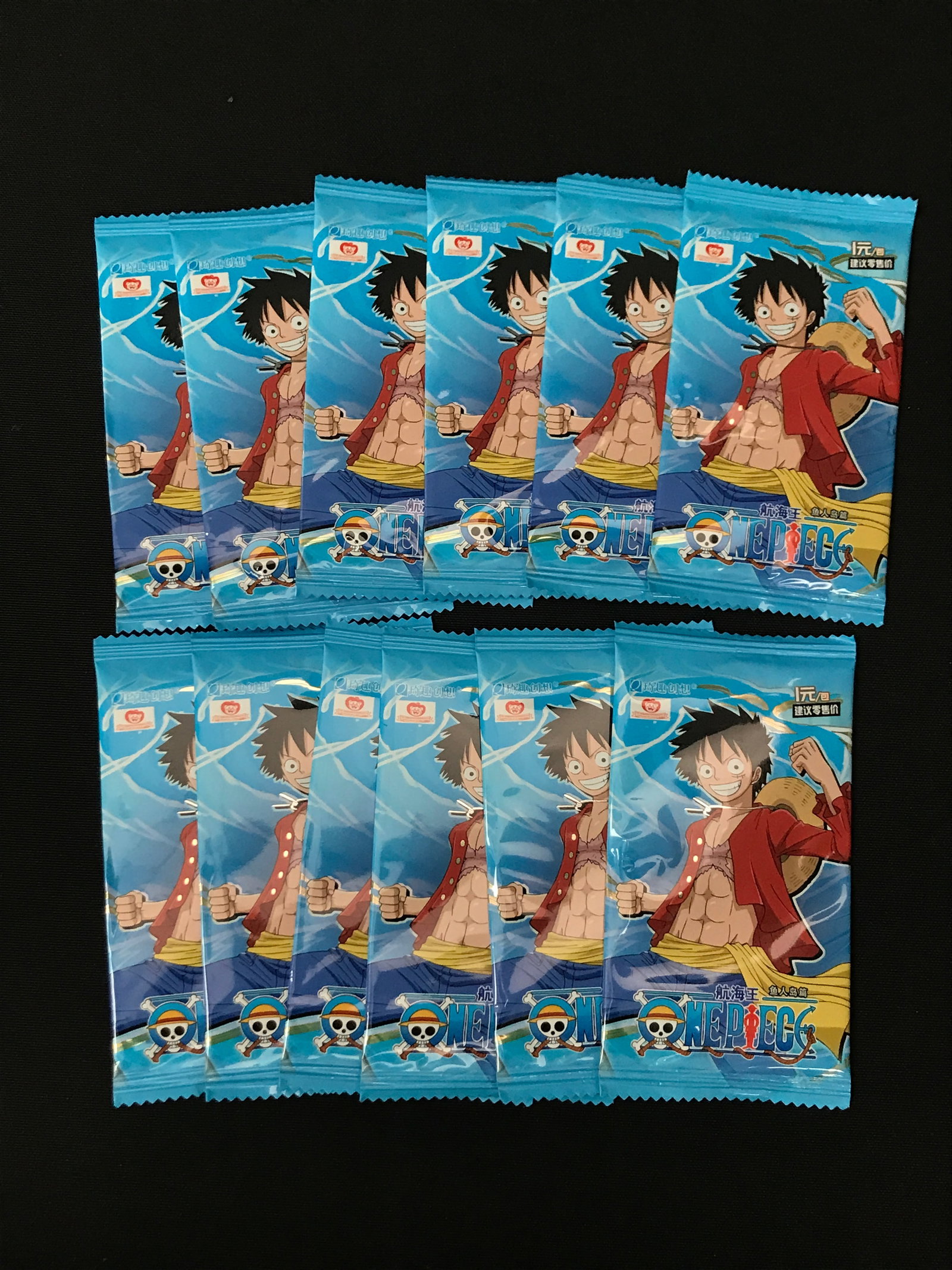 LOT OF 12 SEALED ONE PIECE BOOSTER PACKS: Prices are in Canadian dollars