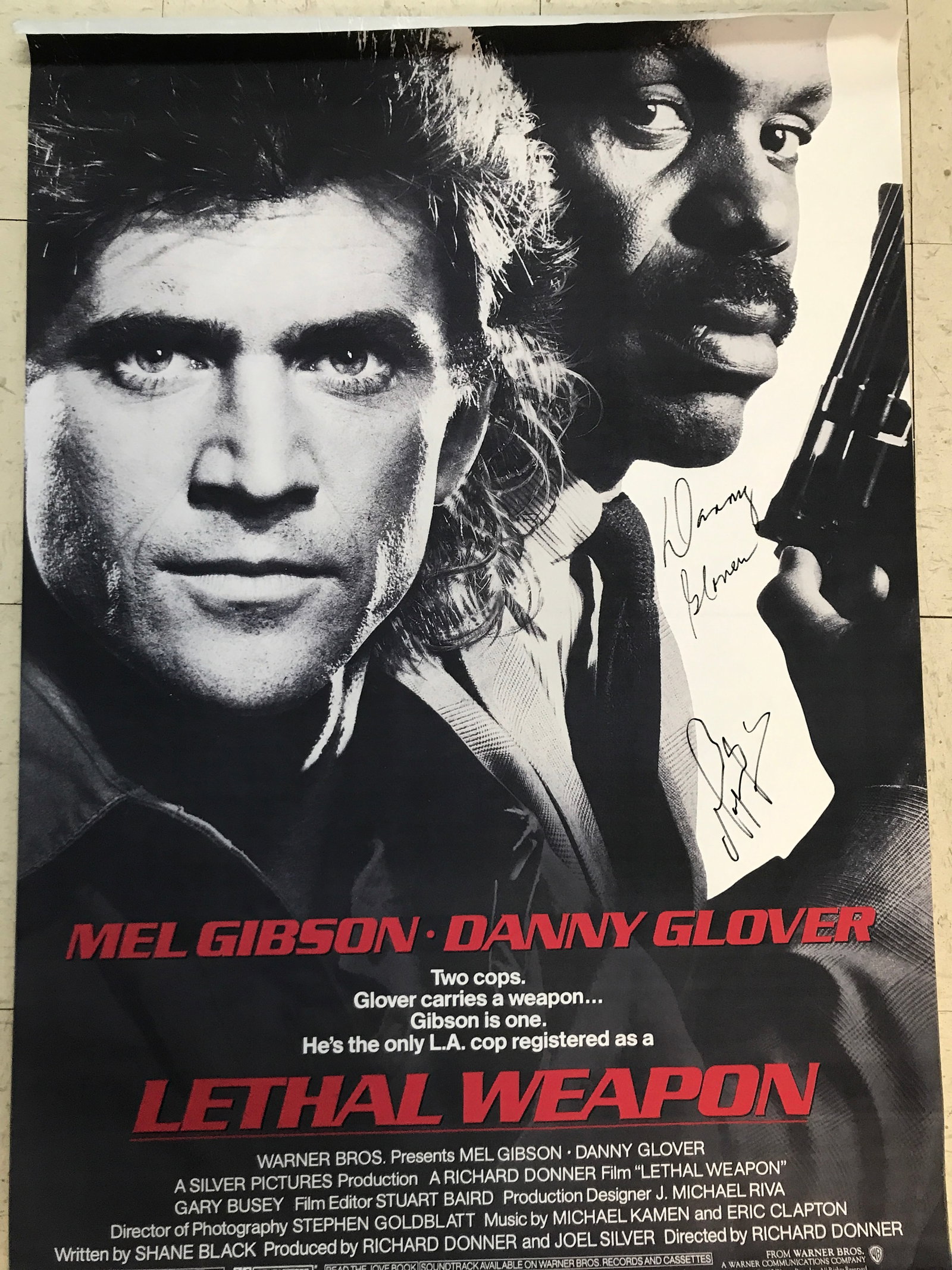 DUAL SIGNED LETHAL WEAPON 24 X 36 MOVIE POSTER MEL GIBSON AND DANNY GLOVER - WWOC COA: Prices are in Canadian dollars