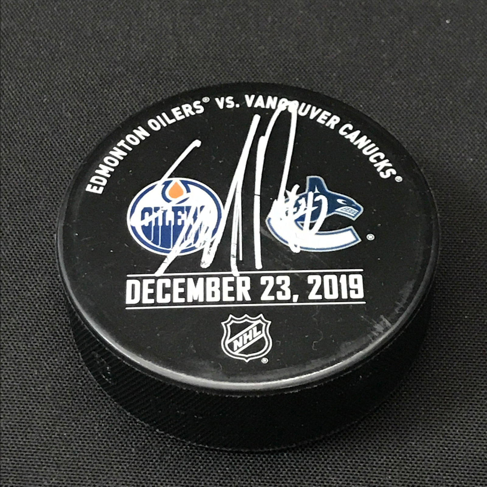 ELIAS PETTERSSON SIGNED PUCK - WWOC COA: Prices are in Canadian dollars
