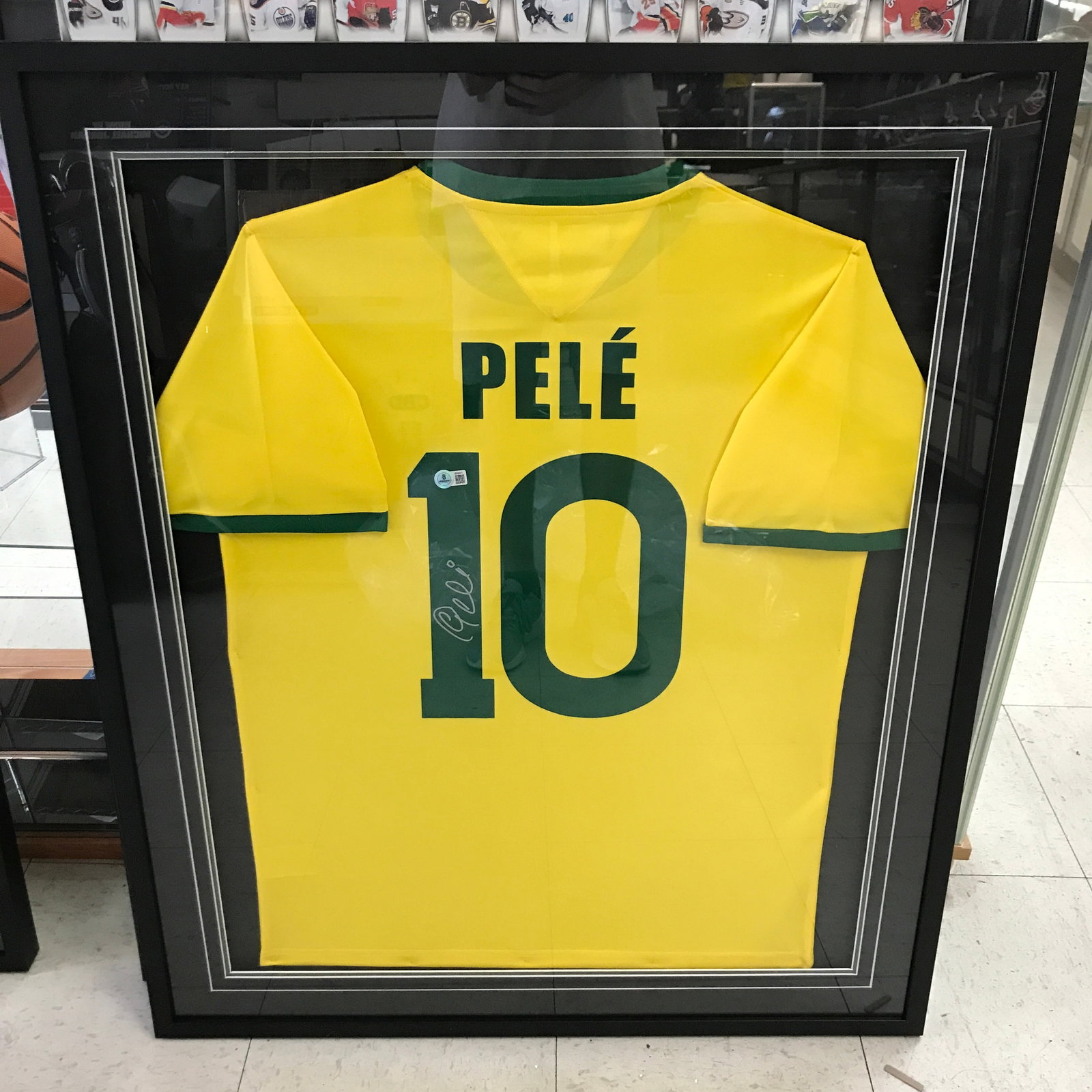 PELE SIGNED AND FRAMED BRASIL JERSEY - BECKETT COA: Prices are in Canadian dollars
