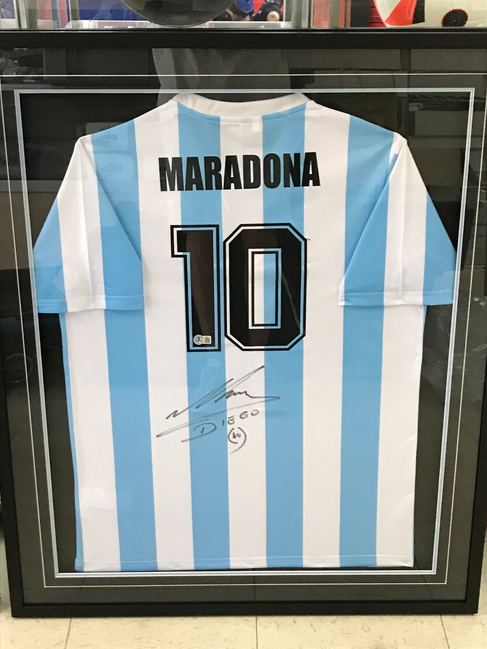 DIEGO MARADONA SIGNED AND CUSTOM FRAMED AREGENTINA SOCCER JERSEY (BECKETT COA): Prices are in Canadian dollars