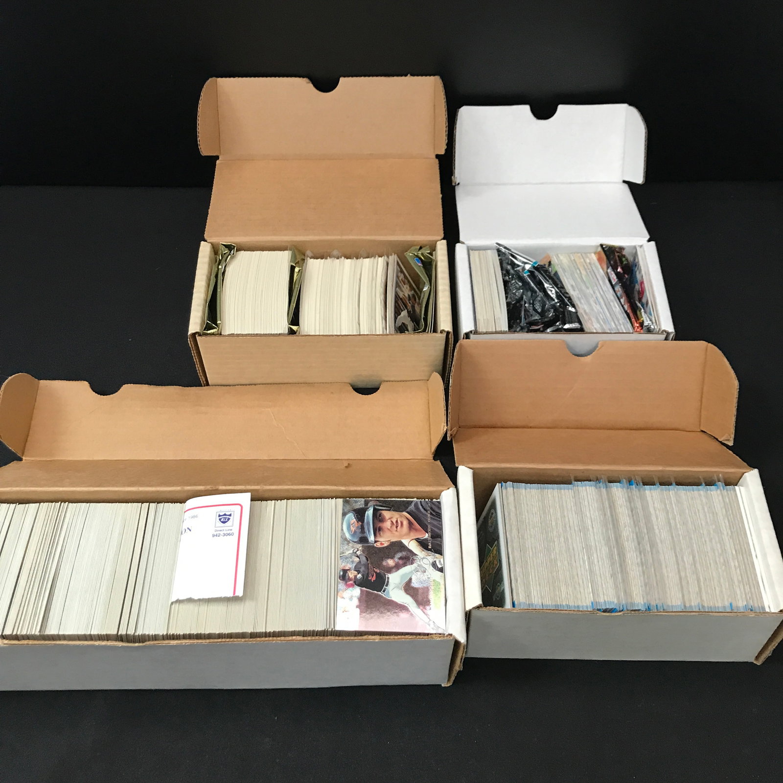 LOT OF 4 BOXES OF SPORTS TRADING CARDS: Prices are in Canadian dollars