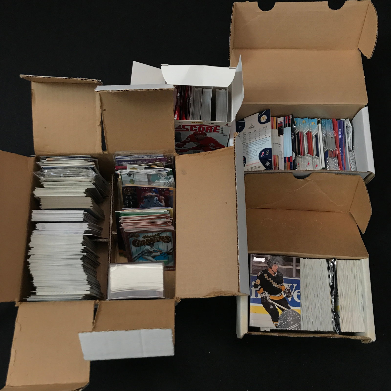 LOT OF 4 BOXES OF SPORTS TRADING CARDS: Prices are in Canadian dollars